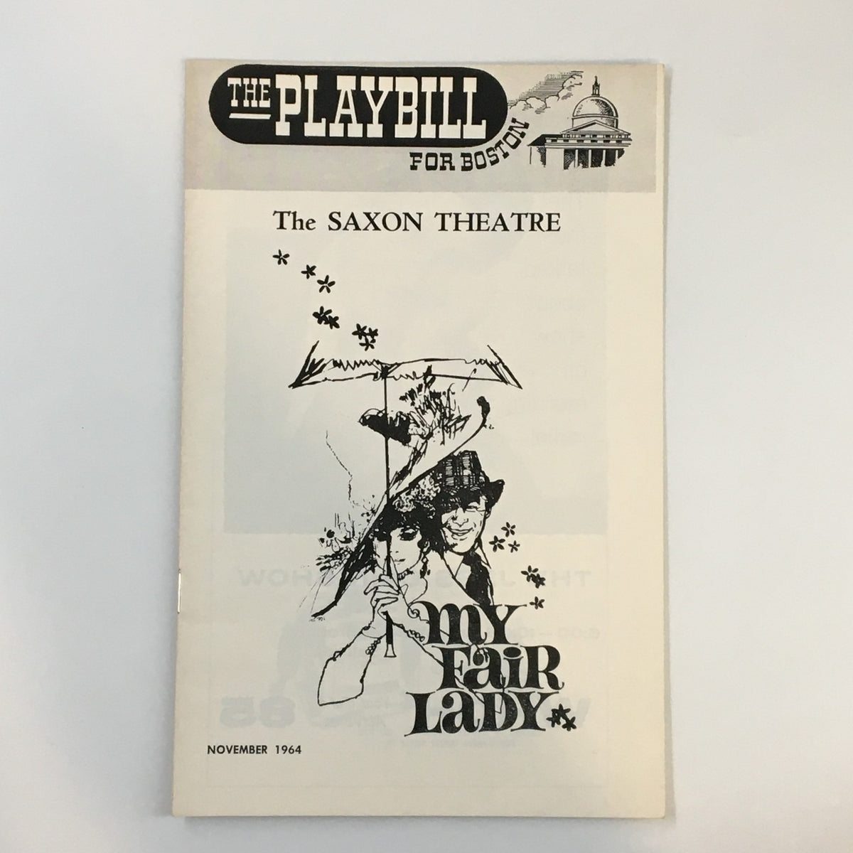 1964 Playbill for My Fair Lady at The Saxon Theatre, featuring the iconic logo and artwork related to the musical.