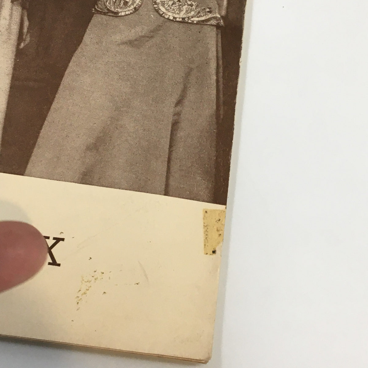 Close-up of the 1939 Playbill for 'The Music Box' showing damage details and the title 'The Music Box'.