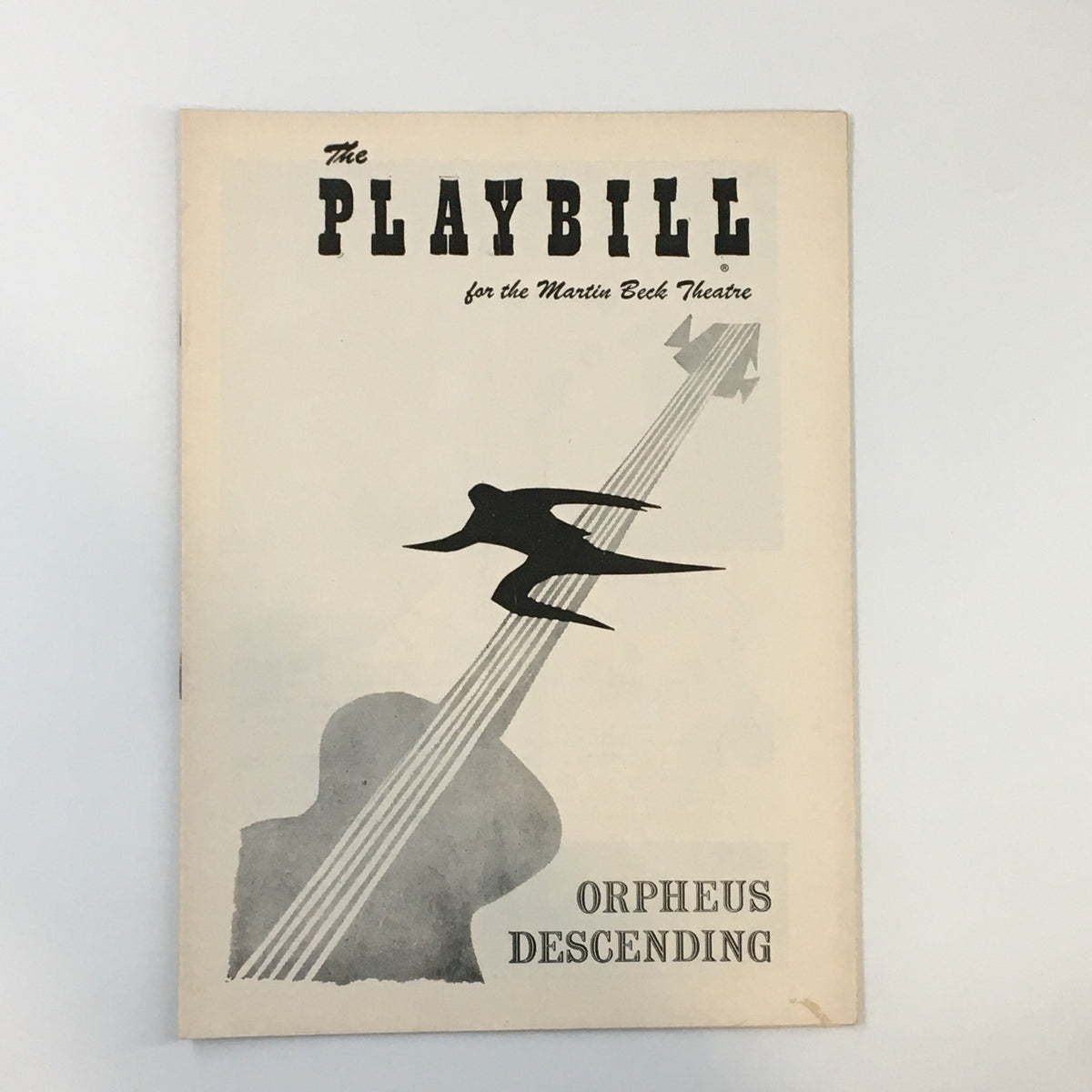 1957 Playbill for Orpheus Descending at Martin Beck Theatre, featuring a graphic of a guitar and a bird motif, representing the theatrical production by Tennessee Williams.