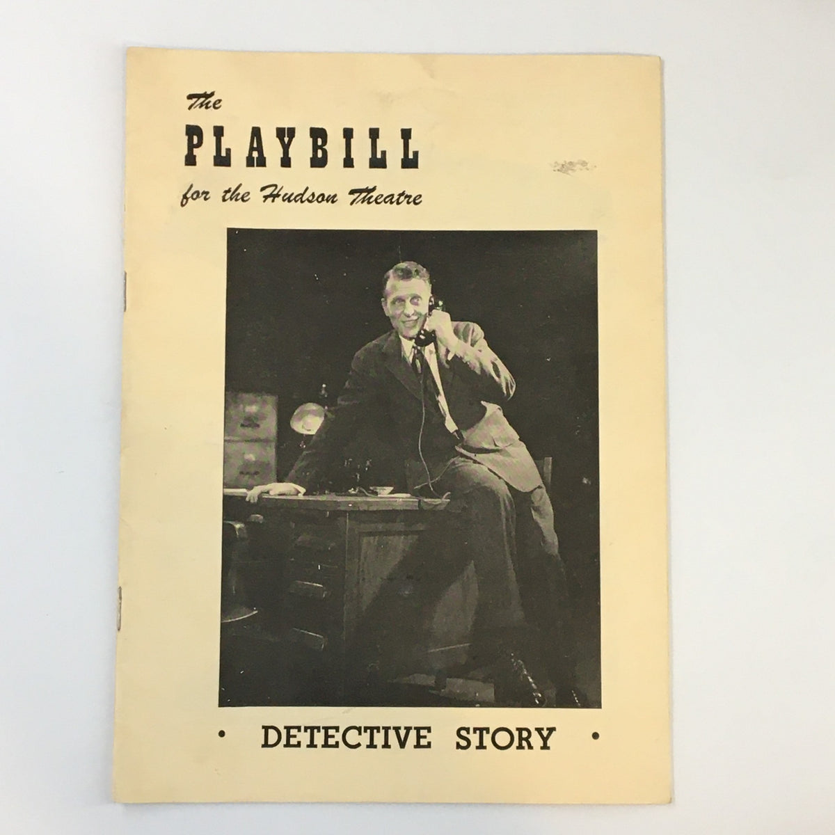 1950 Playbill from the Hudson Theatre featuring Ralph Bellamy in the production of Detective Story, showcasing a vintage cover with a black-and-white photo of a man at a desk making a phone call.