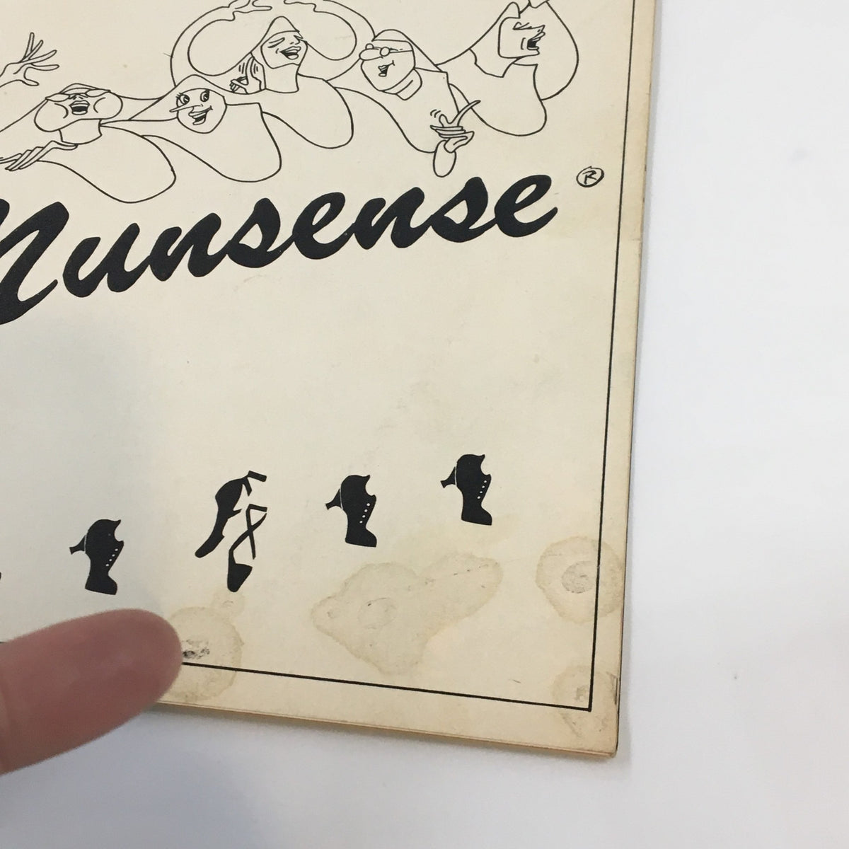 Close-up of the 1986 Playbill for Nunsense, highlighting minor wear and details on the cover.
