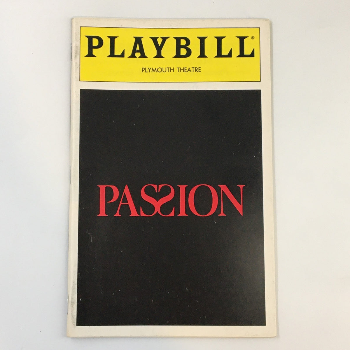 1994 Playbill for the musical Passion at Plymouth Theatre featuring prominent title design in red and iconic logo.