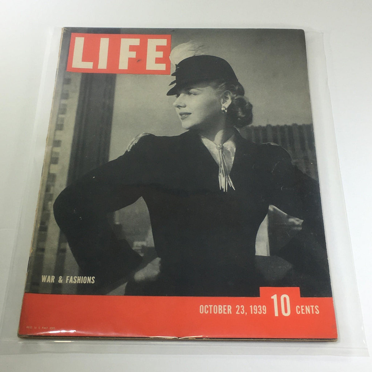 Cover of Vintage Life Magazine: October 23 1939 - War And Fashions, featuring a poised woman in stylish attire, highlighting the intersection of fashion and the historical context of World War II.