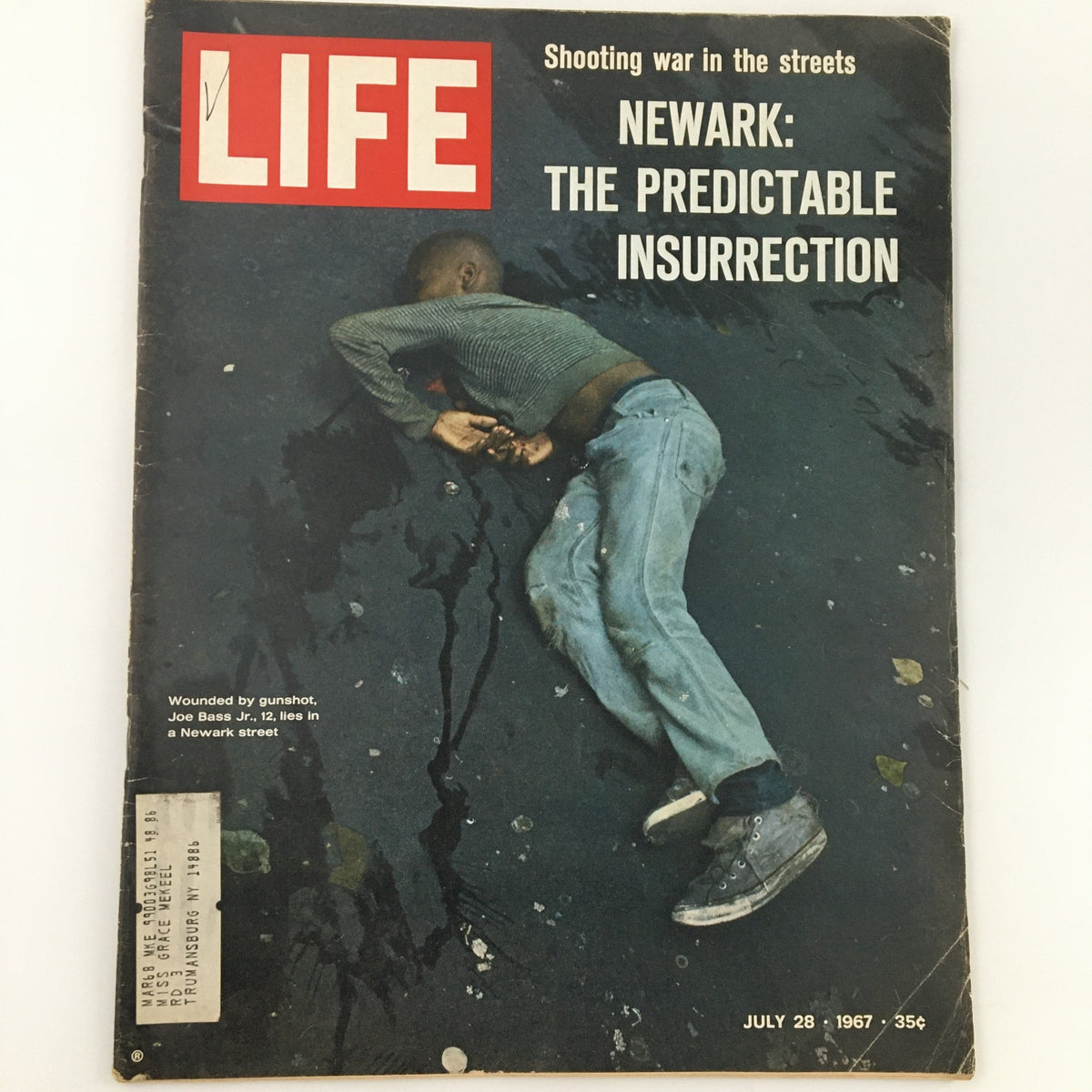 Vintage Life Magazine from July 28, 1967, featuring the cover story 'Joe Bass Jr. Lies in Newark Street, Wounded.' The cover depicts a powerful image related to the Newark insurrection with a focus on urban street violence.