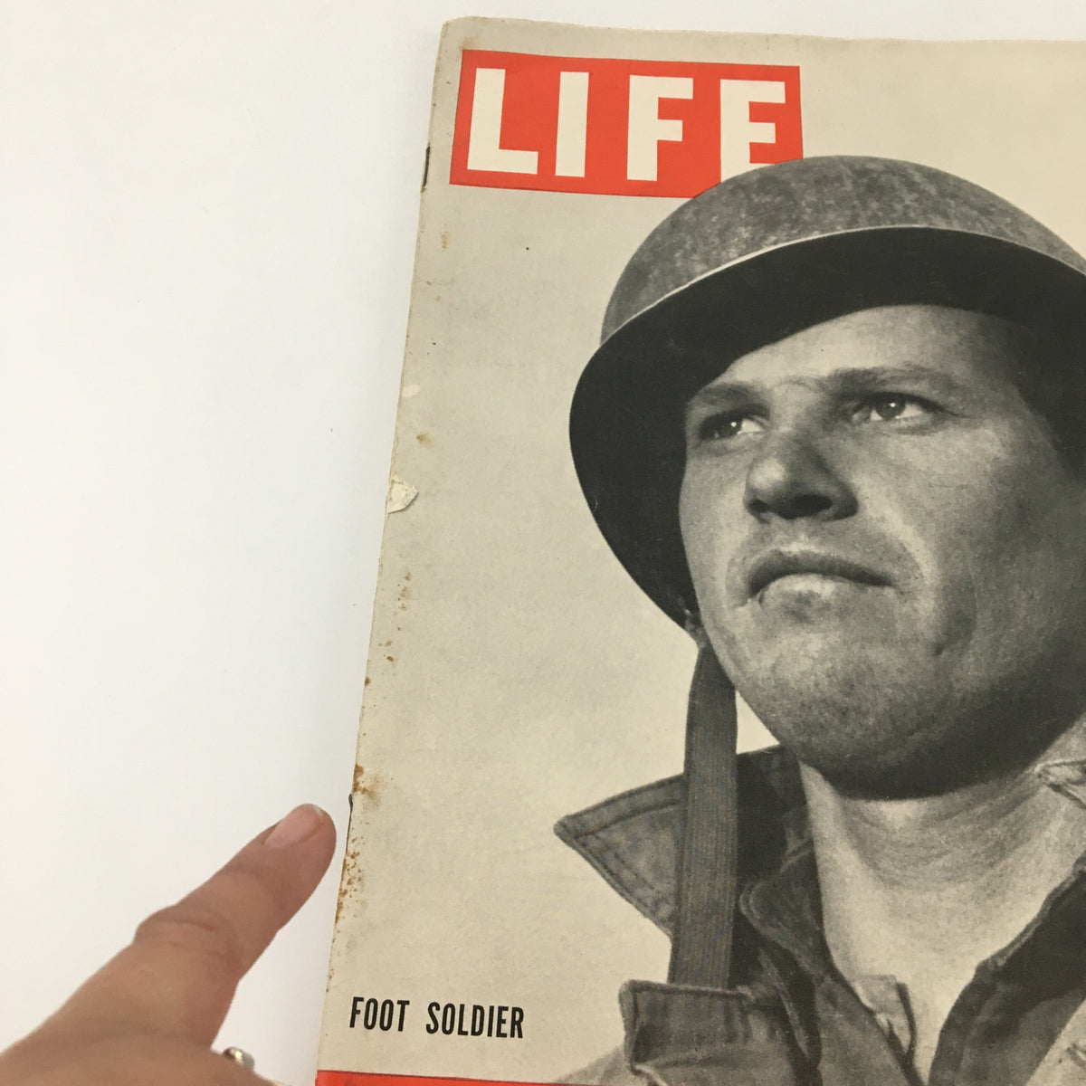 Close-up view of the cover of VTG Life Magazine November 22, 1943 showcasing a foot soldier, emphasizing the wartime narrative and history.