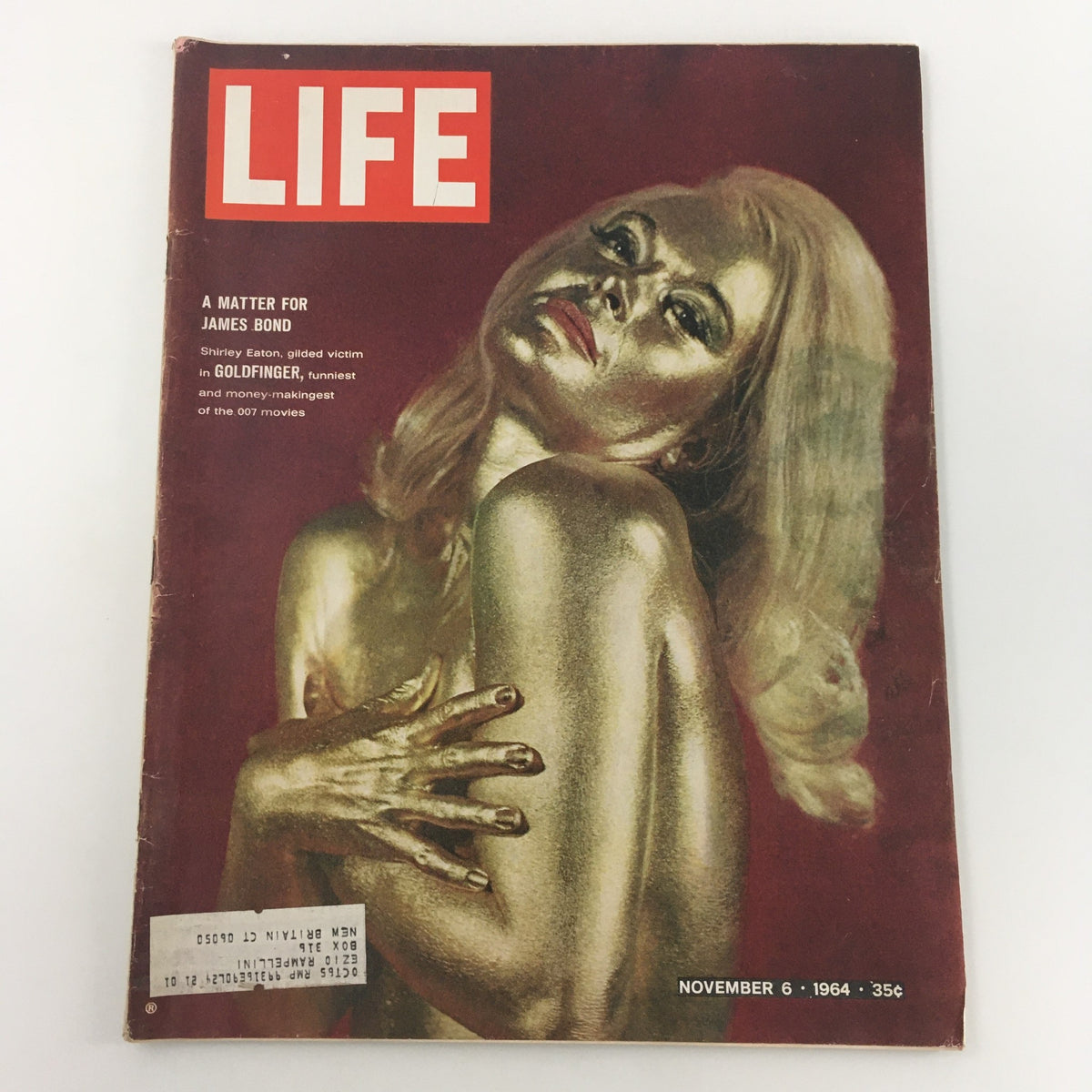 VTG Life Magazine November 6 1964 featuring Shirley Eaton as the gilded victim in Goldfinger, showcasing an iconic cover design with gold-toned artwork that highlights the glamour of the 1960s.