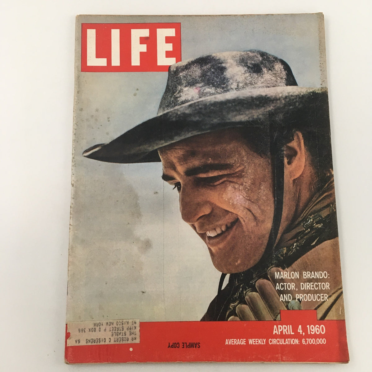Vintage Life Magazine April 4, 1960 with Marlon Brando on the cover, featuring the text 'Marlon Brando: Actor, Director and Producer' and a 'Sample Copy' label, showcasing the actor's iconic presence.