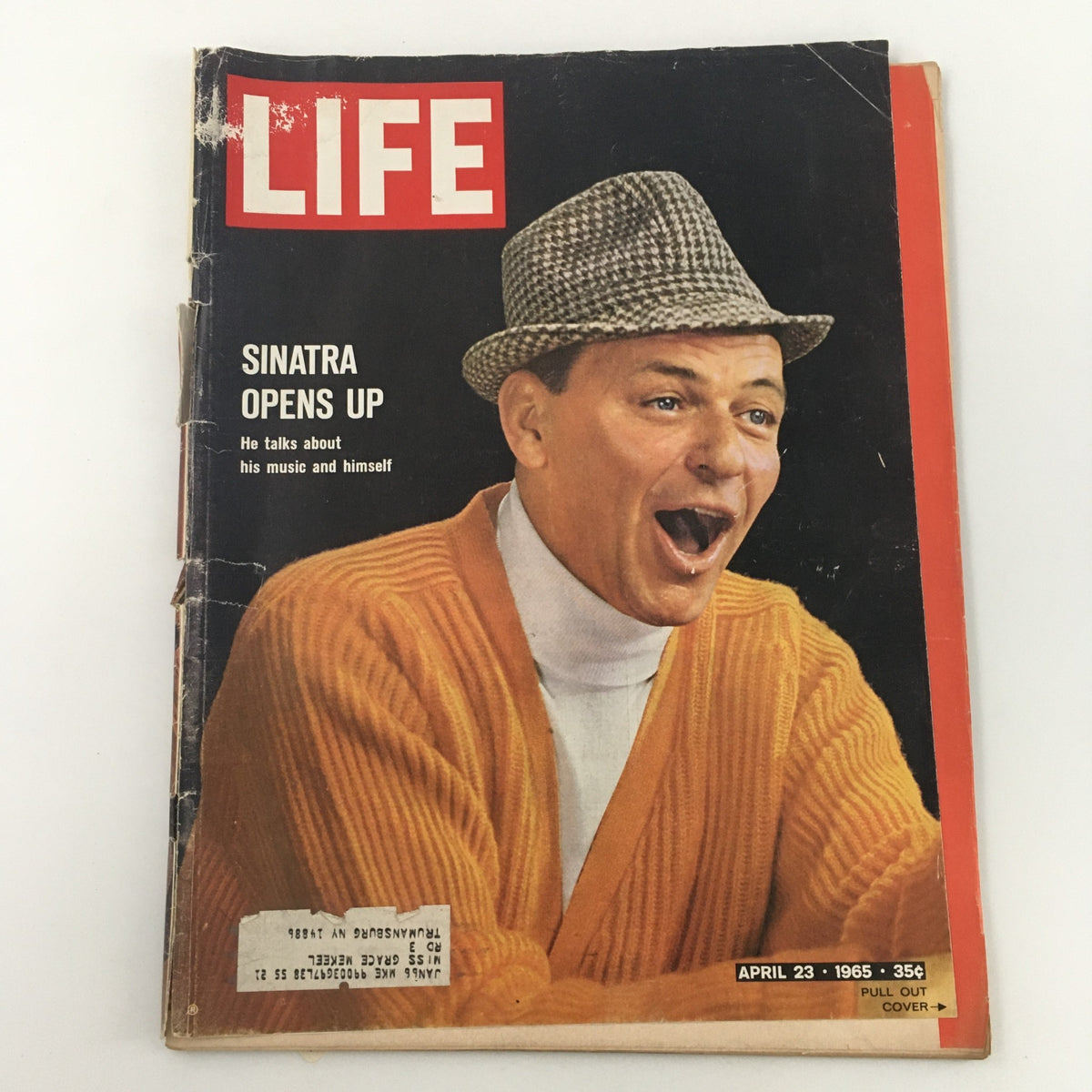 VTG Life Magazine April 23, 1965 featuring Frank Sinatra on the cover, discussing his music and personal reflections. The magazine showcases Sinatra wearing a hat and bright orange cardigan, embodying the style of the 1960s.