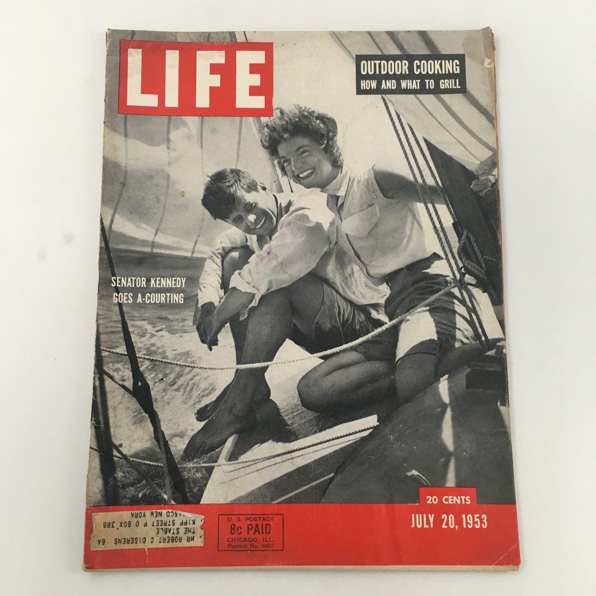 Cover of VTG Life Magazine dated July 20, 1953, featuring the article 'John Kennedy Goes A Courting to Young Jackie.' The cover shows a young couple on a sailboat, capturing a moment of romance.