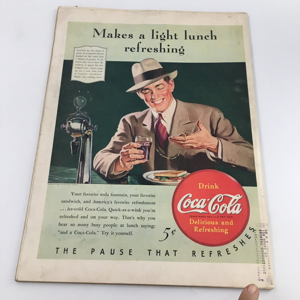 Back cover of VTG Life Magazine February 19 1940, featuring a vintage Coca-Cola advertisement with a smiling man at a soda fountain.
