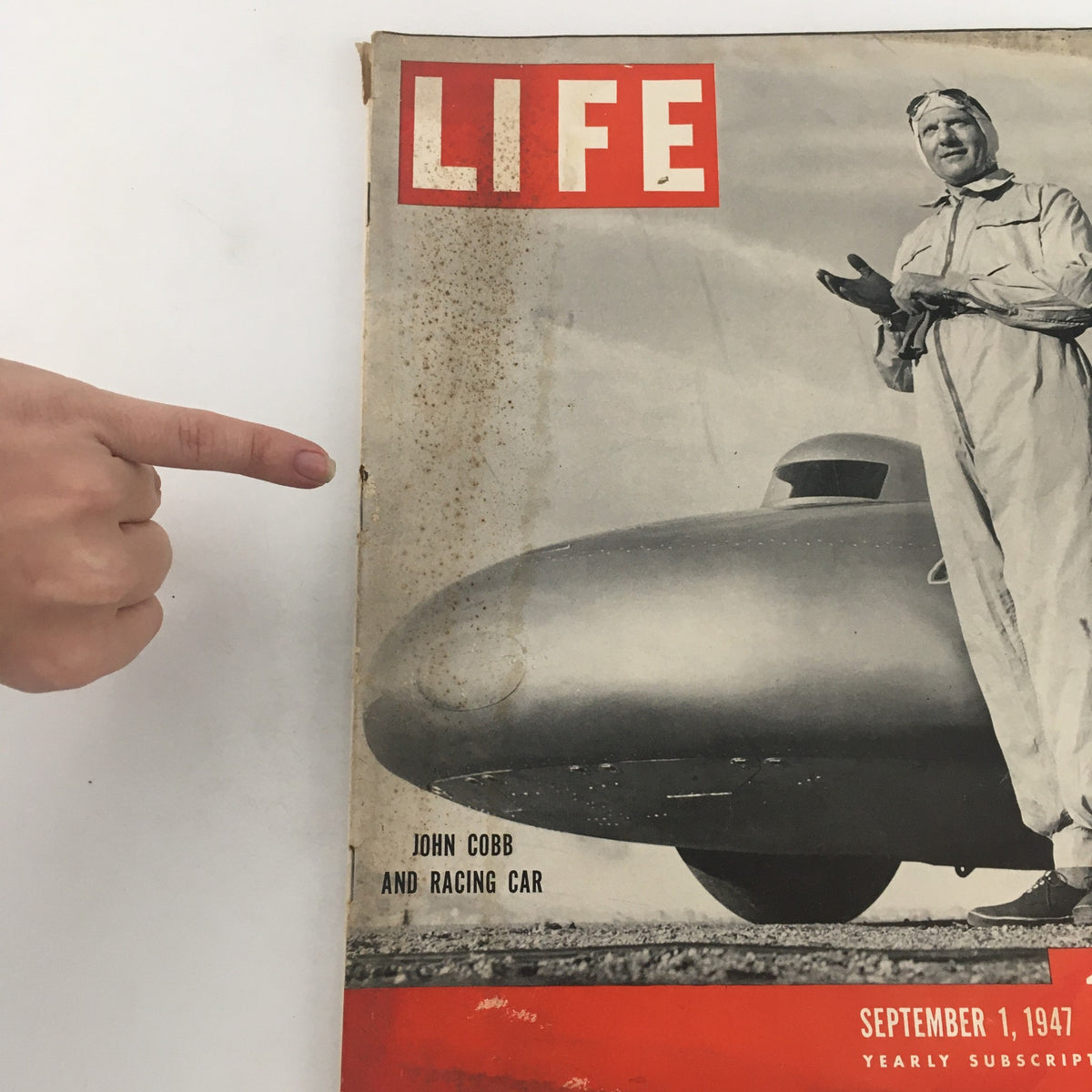 Close-up view of the Life Magazine September 1, 1947 cover featuring John Cobb and Racing Car, highlighting details like the magazine title and date.