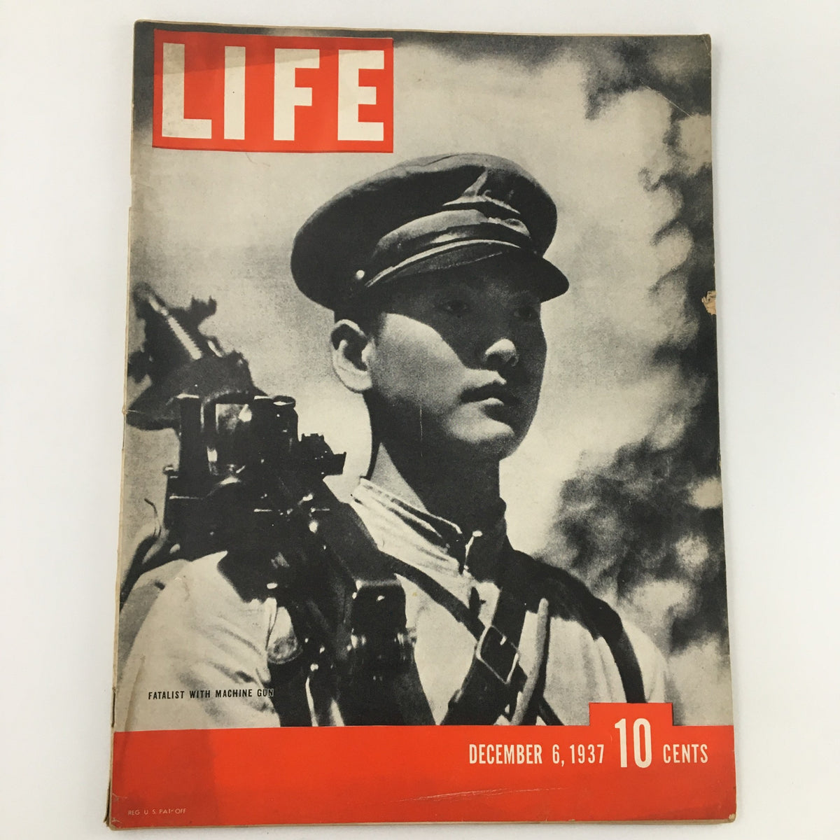 VTG Life Magazine December 6 1937 featuring a photo of a fatalist with a machine gun on the cover. A valuable collectible representing a pivotal moment in 20th-century history.
