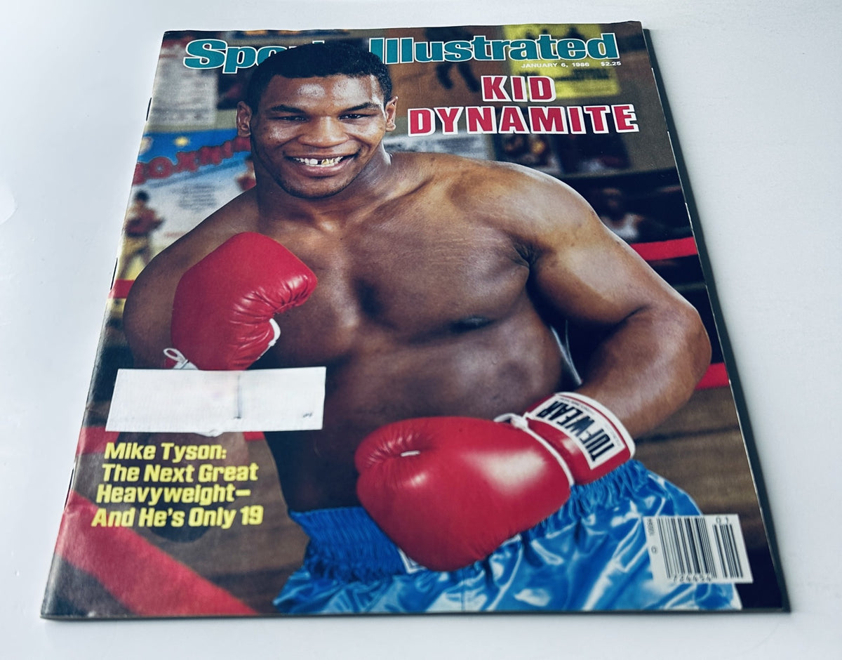 Cover of Sports Illustrated Magazine January 6, 1986 featuring Mike Tyson, known as Kid Dynamite, showcasing his boxing gloves and intense smile.