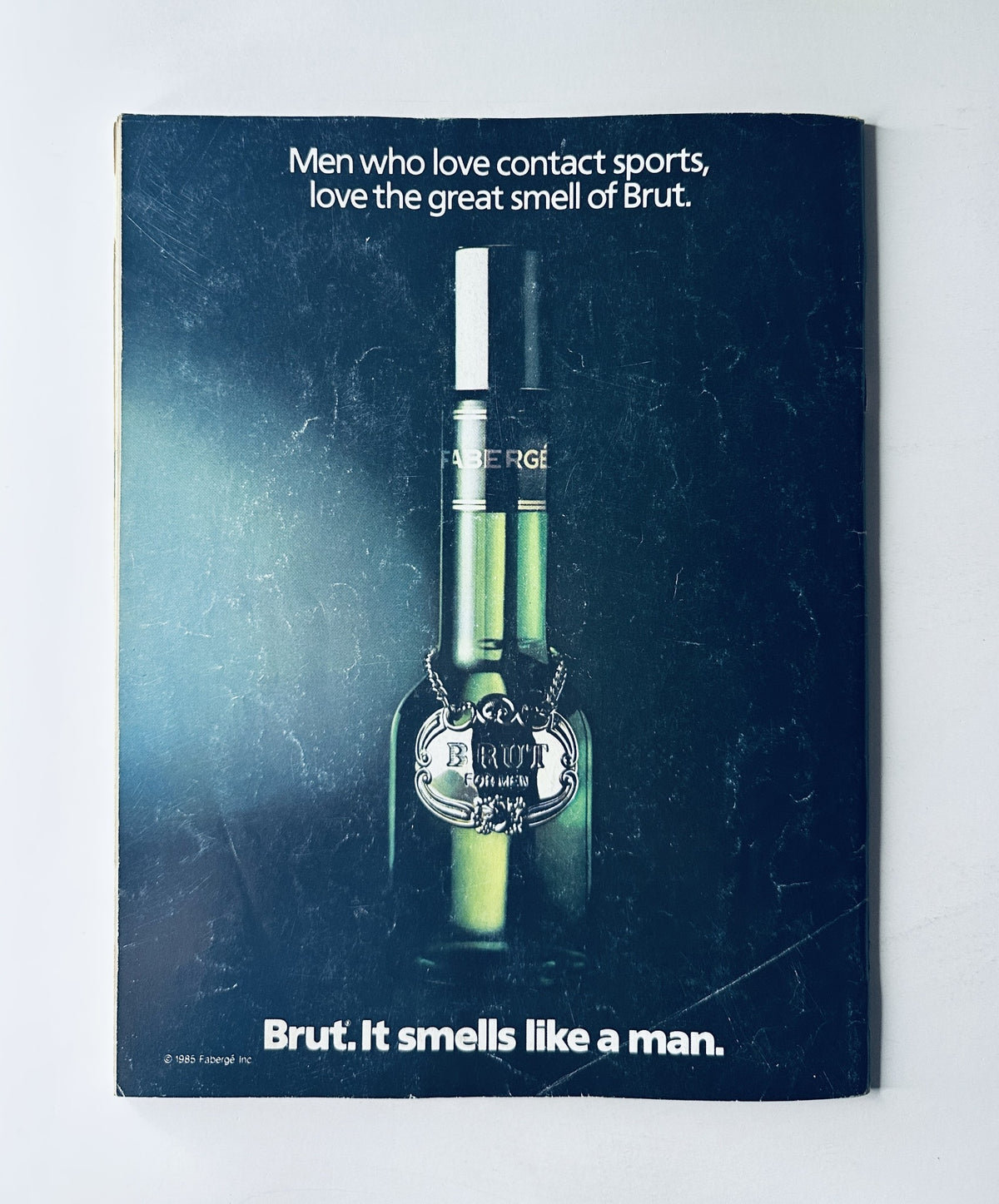 Back cover of WWF Magazine August 1987 featuring an advertisement for Brut, targeting men who love contact sports, reinforcing the magazine's audience appeal.