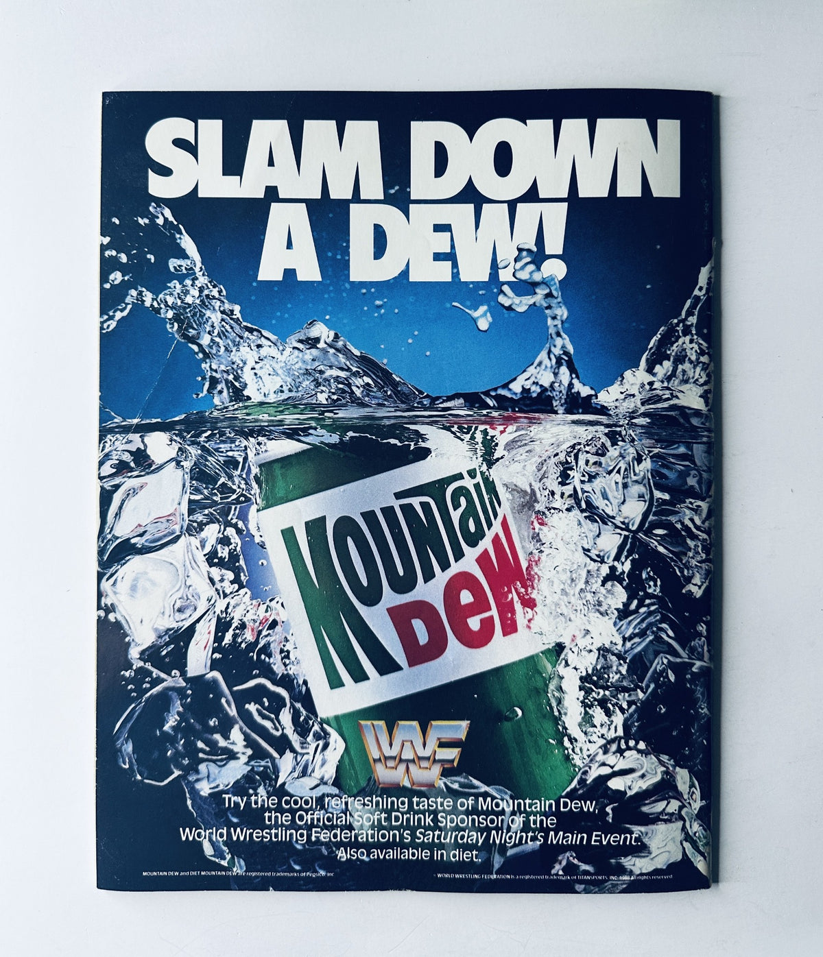 Advertisement page from WWF Magazine June 1990 featuring Mountain Dew, promoting it as the official drink sponsor of the World Wrestling Federation.