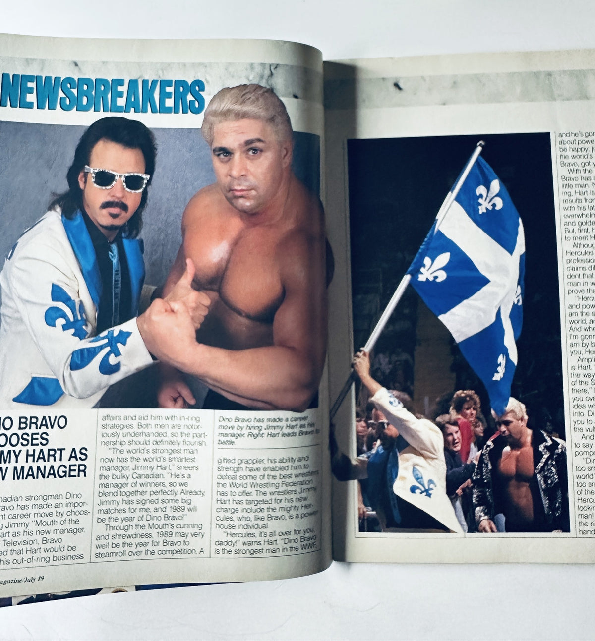 Inside spread of WWF Magazine July 1989 showcasing 'Newsbreakers' section with images of Dino Bravo and his manager, and a promotional photo of wrestling action featuring the Quebecers.