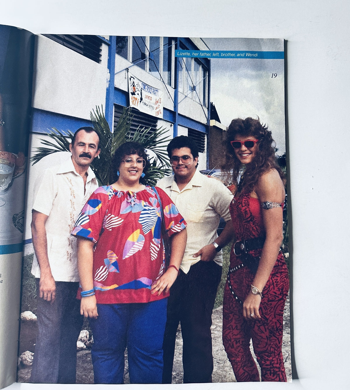 Page from WWF Magazine February/March 1986 featuring a group photo with notable individuals, adding character to the wrestling community.