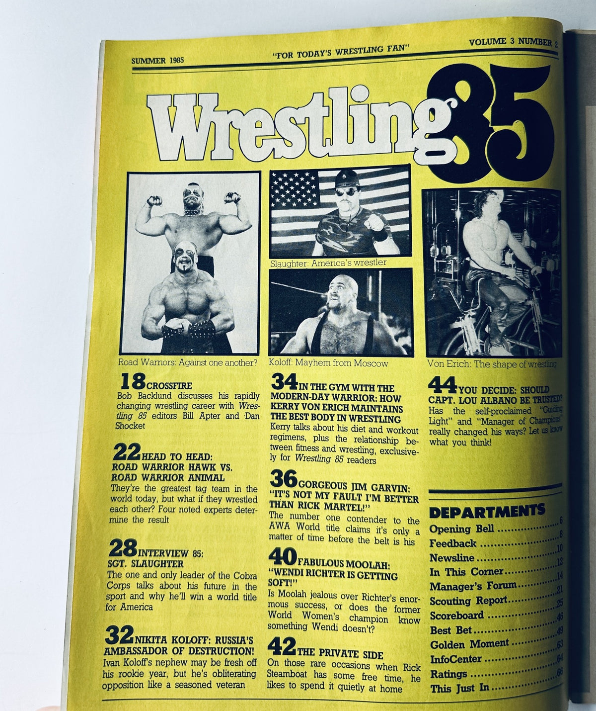 Inner page of Wrestling '85 Magazine, Summer 1985, displaying featured articles including the Road Warriors and Nikita Koloff, with wrestling themes and graphics.