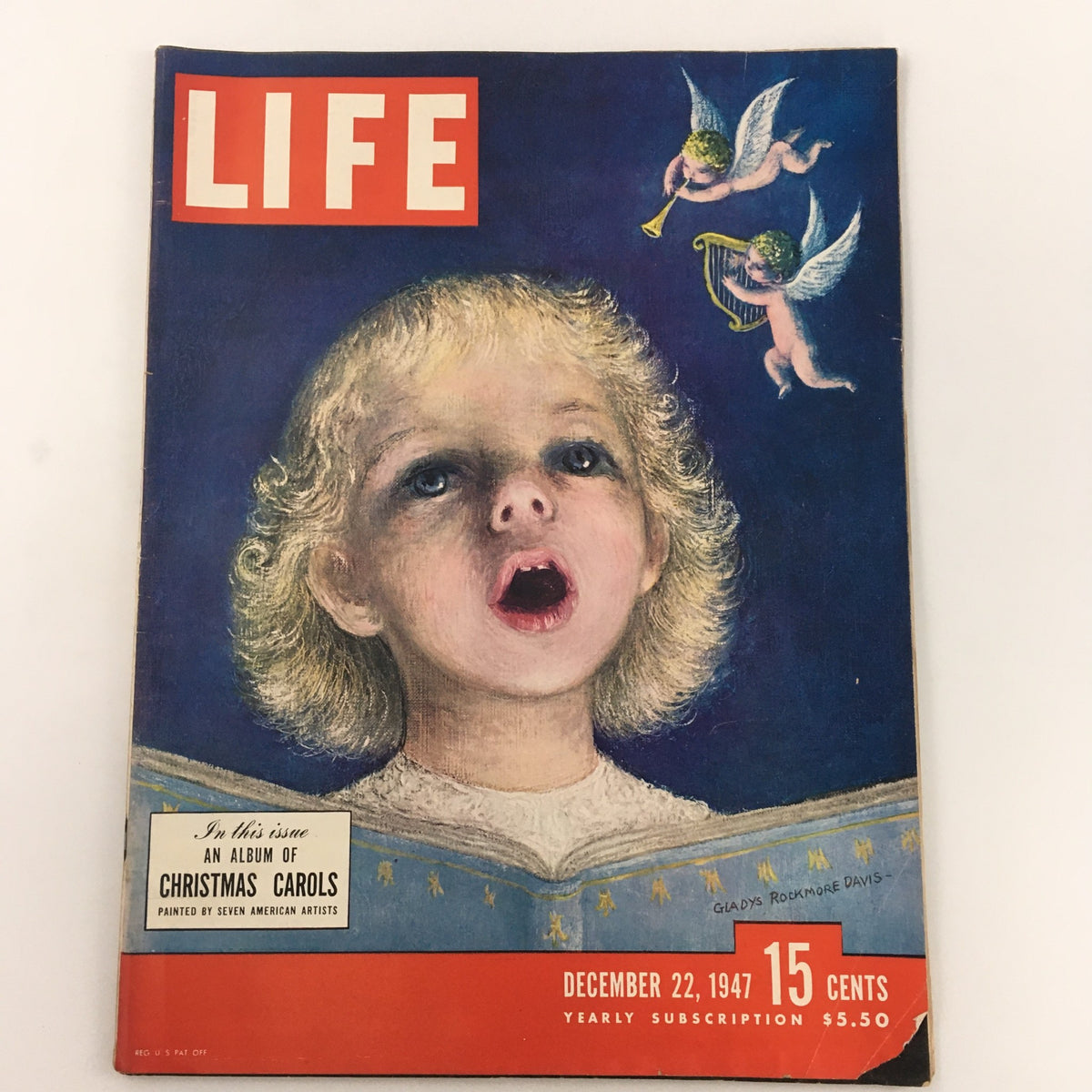 Cover of Life Magazine December 22, 1947 featuring a child singing and angels playing instruments, titled 'An Album of Christmas Carols'. This vintage magazine captures the festive spirit of the 1940s.