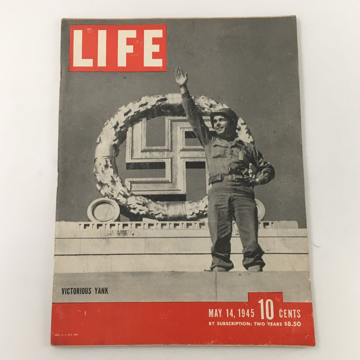 Cover of VTG Life Magazine, May 14, 1945, featuring the title 'Germany's Victorious Yank'. The magazine showcases a soldier waving in front of a large swastika emblem, symbolizing post-war sentiment.