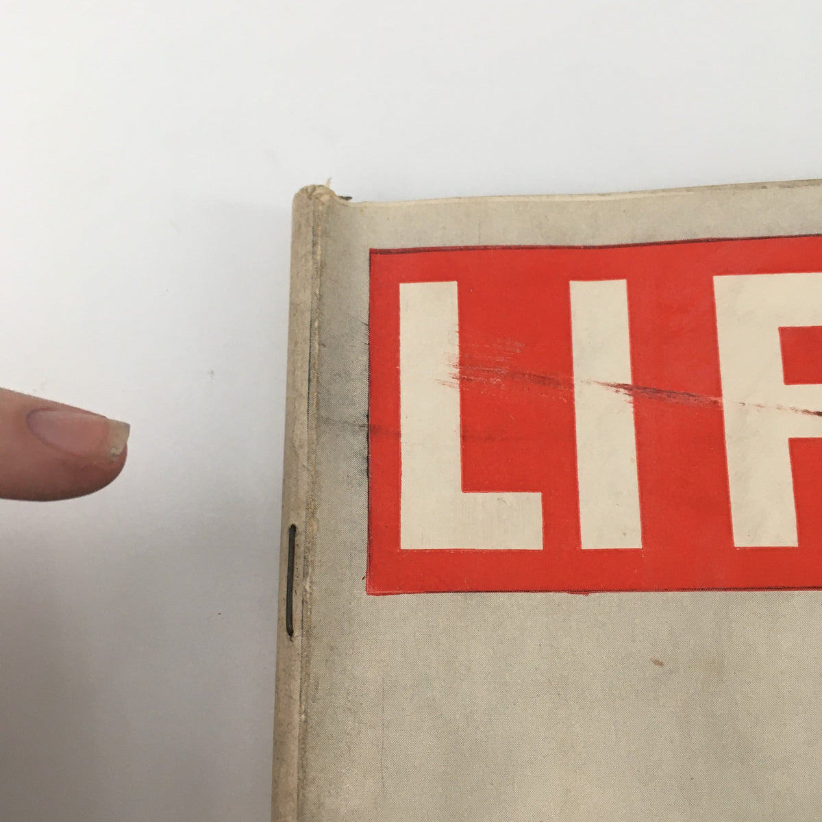 Close-up view of the cover of the VTG Life Magazine April 6, 1942, featuring the iconic 'LIFE' logo, showcasing minor wear and tear indicative of its age and newsstand condition.