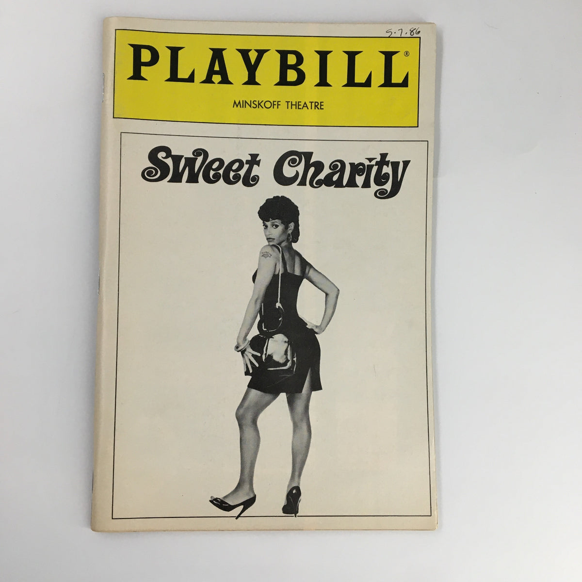 1986 Playbill from the Minskoff Theatre featuring 'Sweet Charity' with a striking black and white cover image of a performer, capturing the essence of 1980s Broadway.