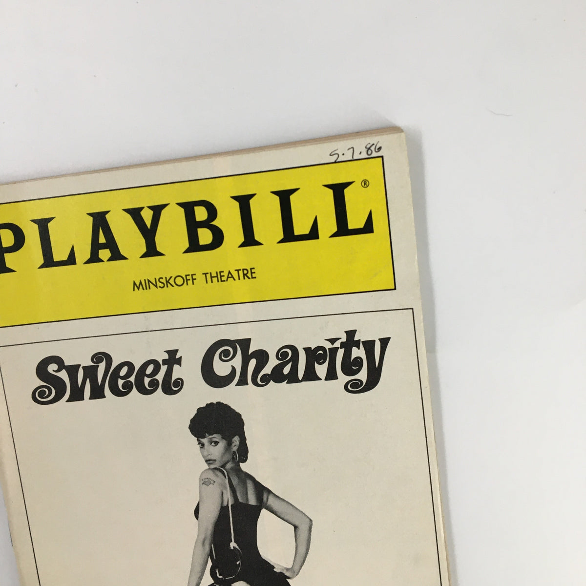1986 Playbill for Sweet Charity at the Minskoff Theatre, featuring a striking cover design with vibrant colors and the date 5.7.86.