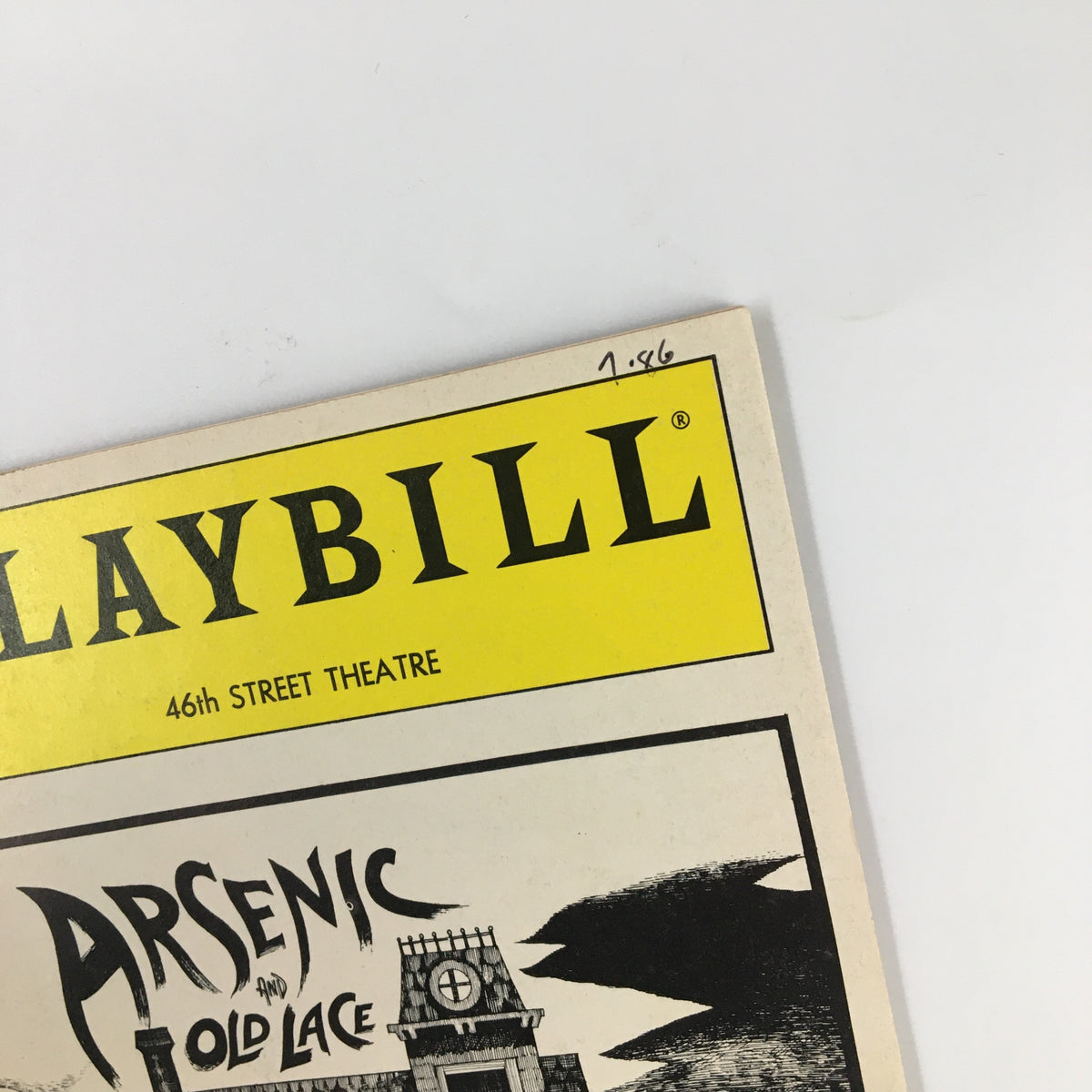 Close-up of the top left corner of the 1986 Playbill Forty-Sixth Theatre Vol 86 #7 showing the date '1-86' and the title 'Arsenic and Old Lace'.