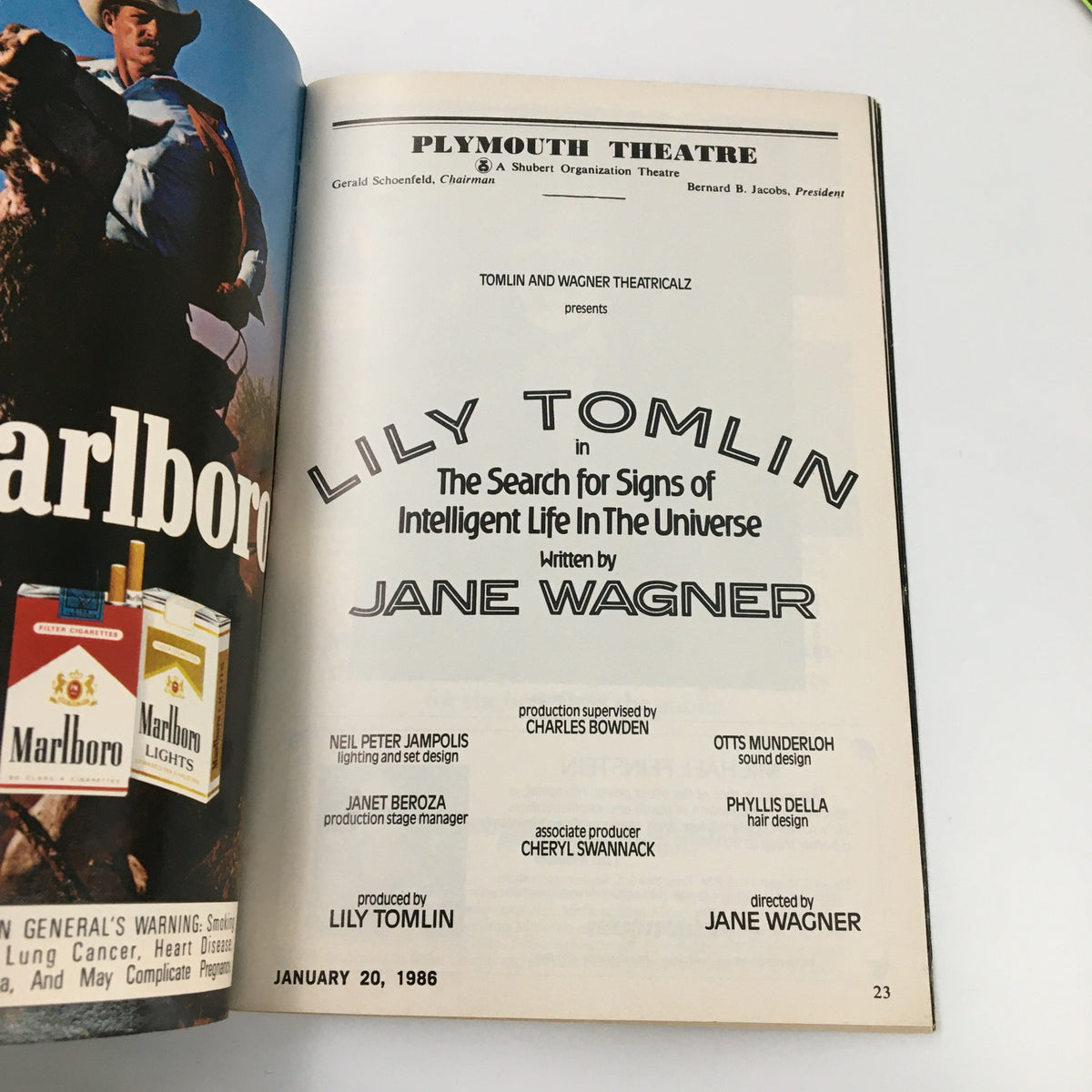 A detailed page from Playbill January 1986, highlighting Lilly Tomlin's performance in The Search for Signs of Intelligent Life in the Universe at Plymouth Theatre, including production credits and contributors.