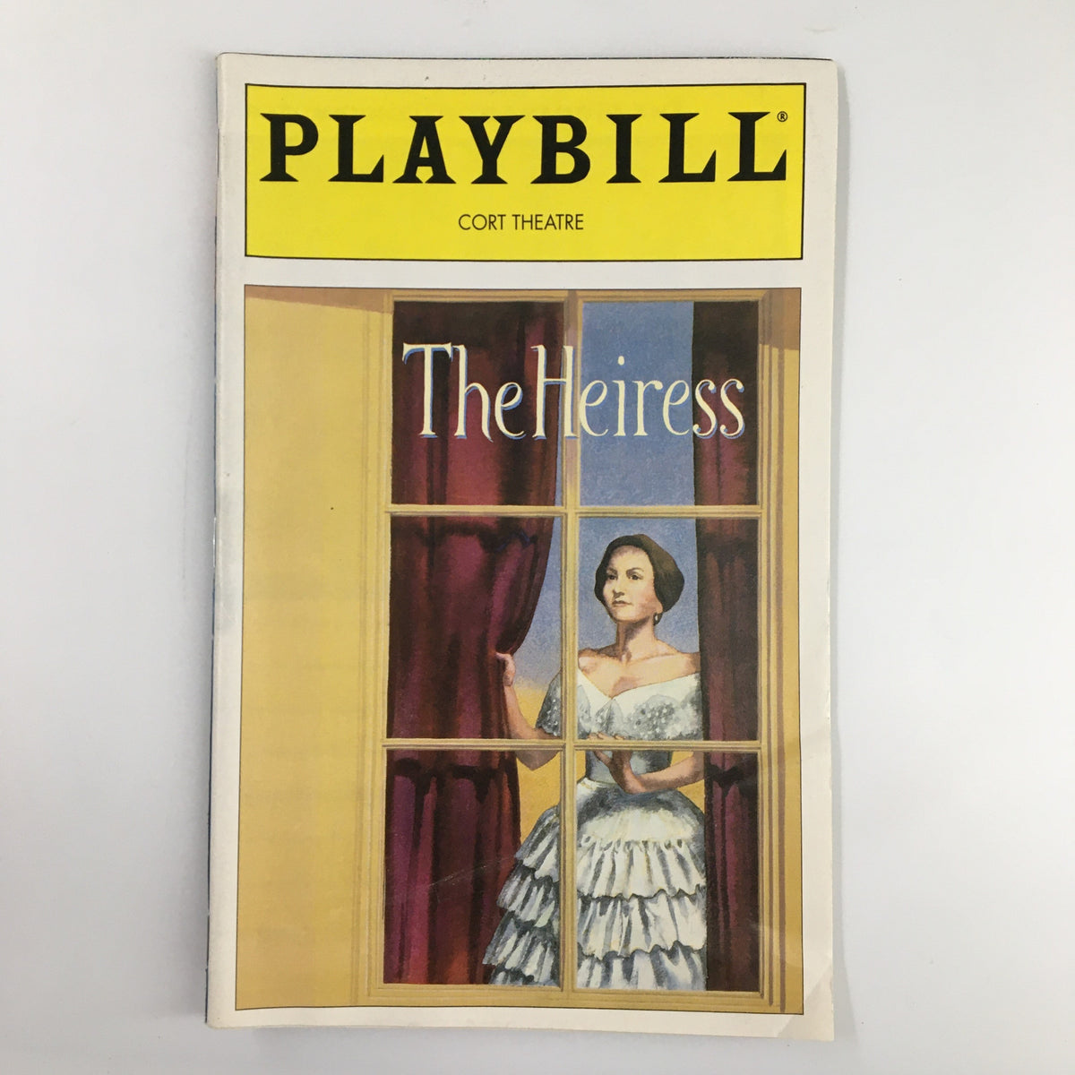 1995 Playbill for The Heiress at Cort Theatre featuring an illustration of a woman in a period dress standing by a window.