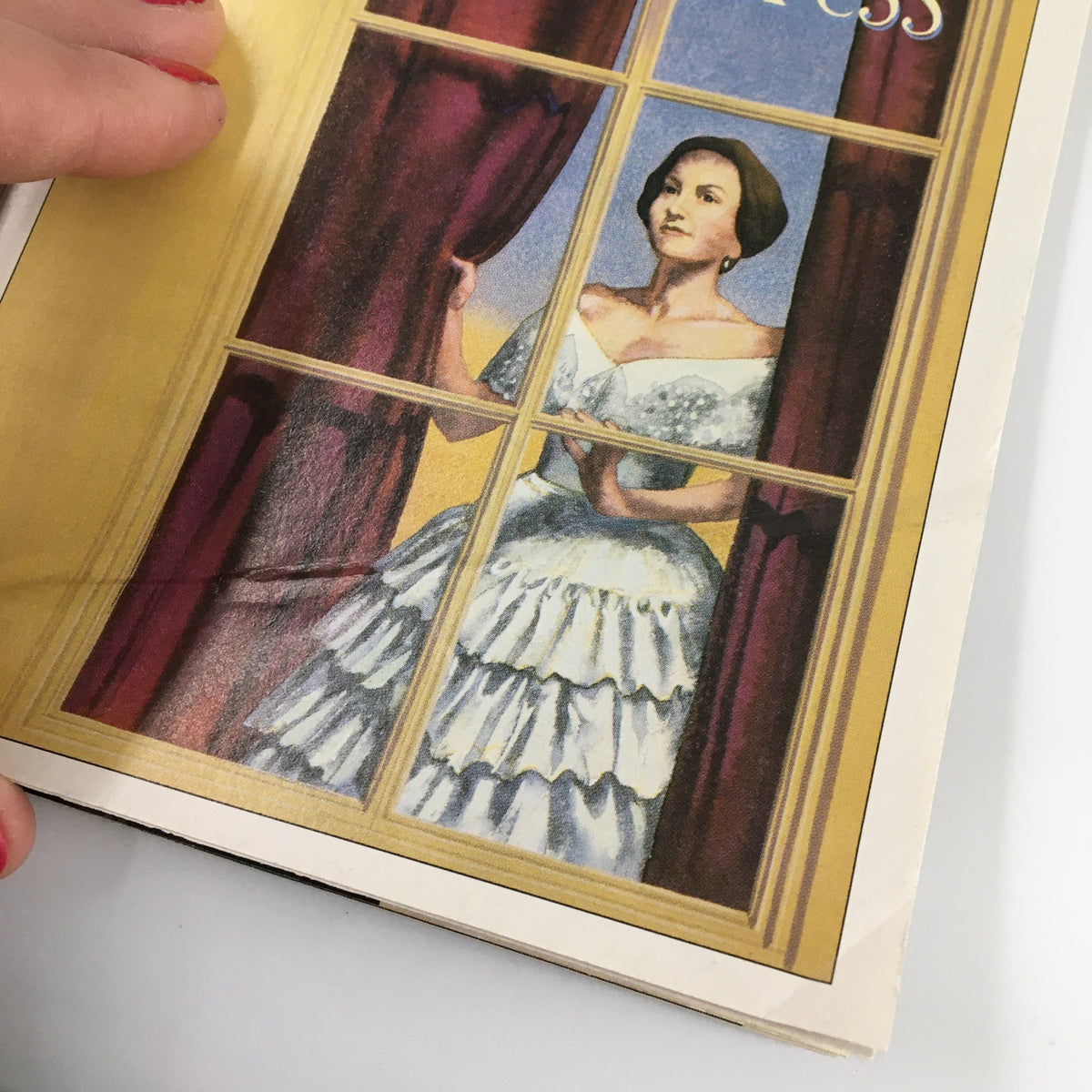 Close-up image of the 1995 Playbill for The Heiress, highlighting the detailed illustration of the protagonist by the window.