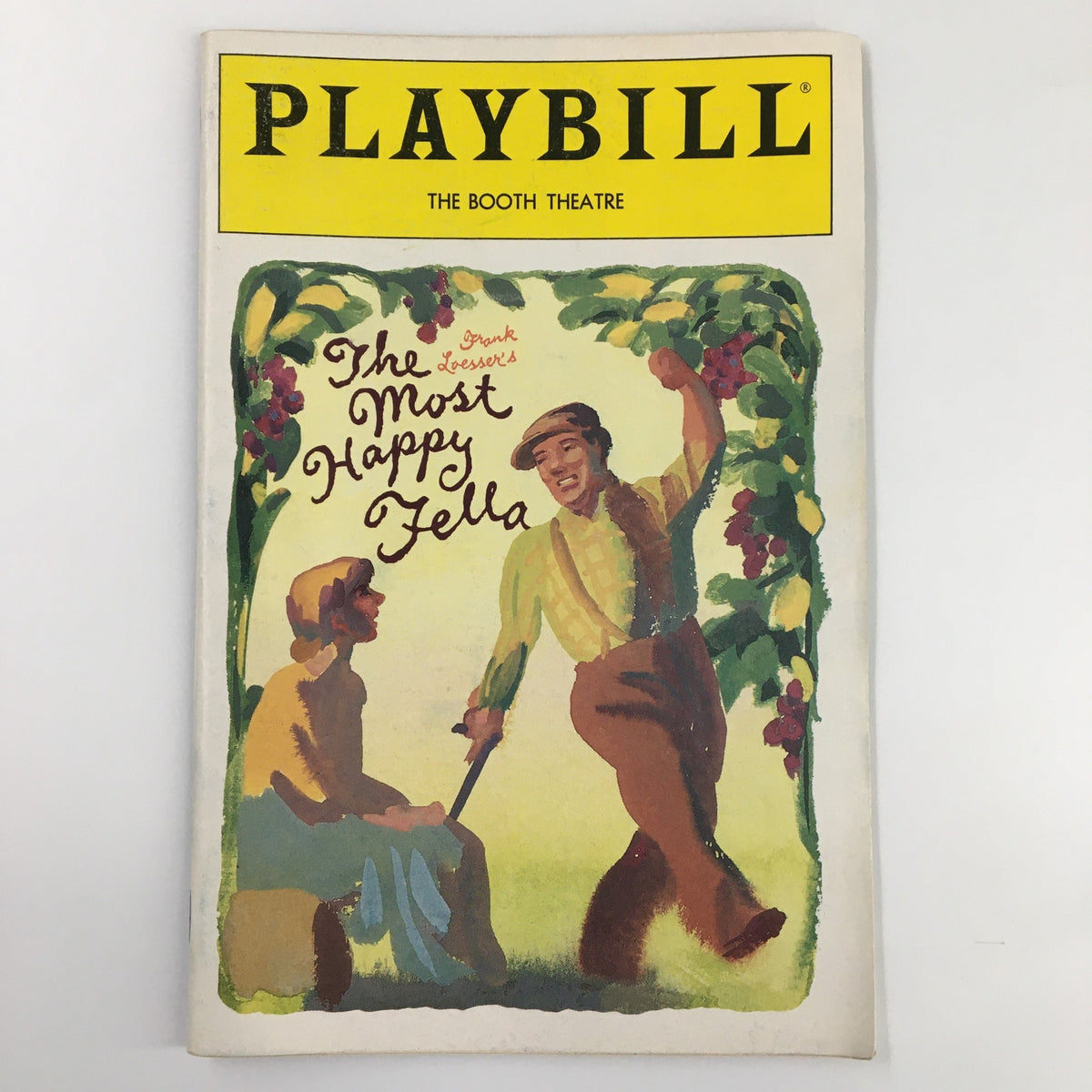 1992 Playbill for The Most Happy Fella by Frank Loesser, featuring a vibrant illustration of characters in a joyful scene, representative of the enchanting Broadway production at The Booth Theatre.