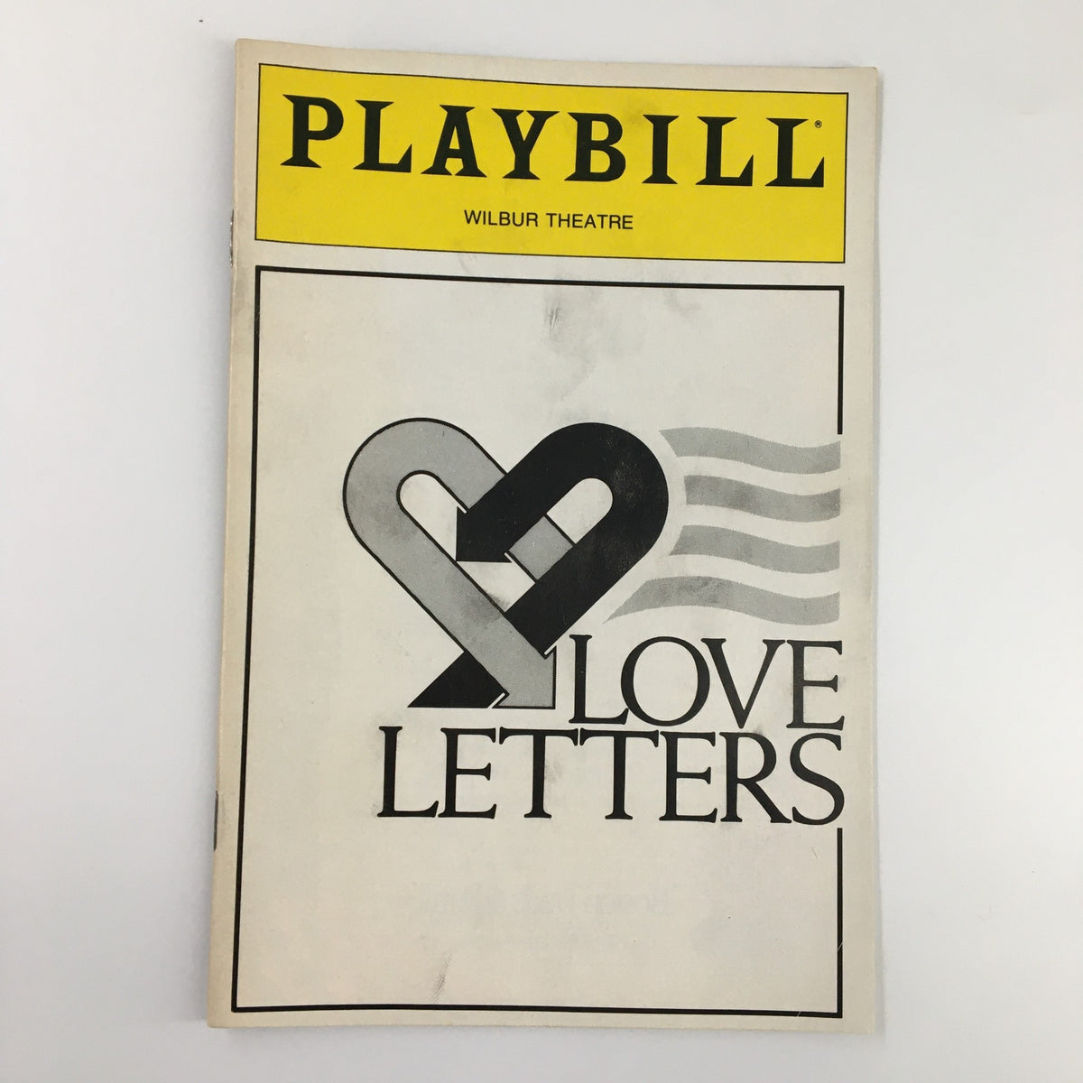 1990 Playbill from Wilbur Theatre for Love Letters featuring a heart symbol and the title in bold letters.