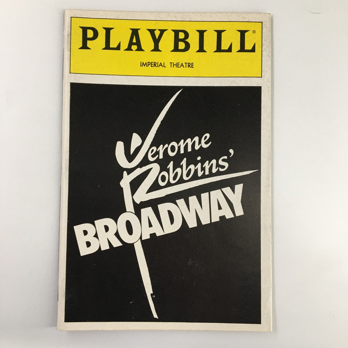 1989 Playbill from the Imperial Theatre showcasing Jerome Robbins' Broadway, featuring a striking black and yellow design. This collectible item highlights the legacy of James M. Barrie's classic tale.