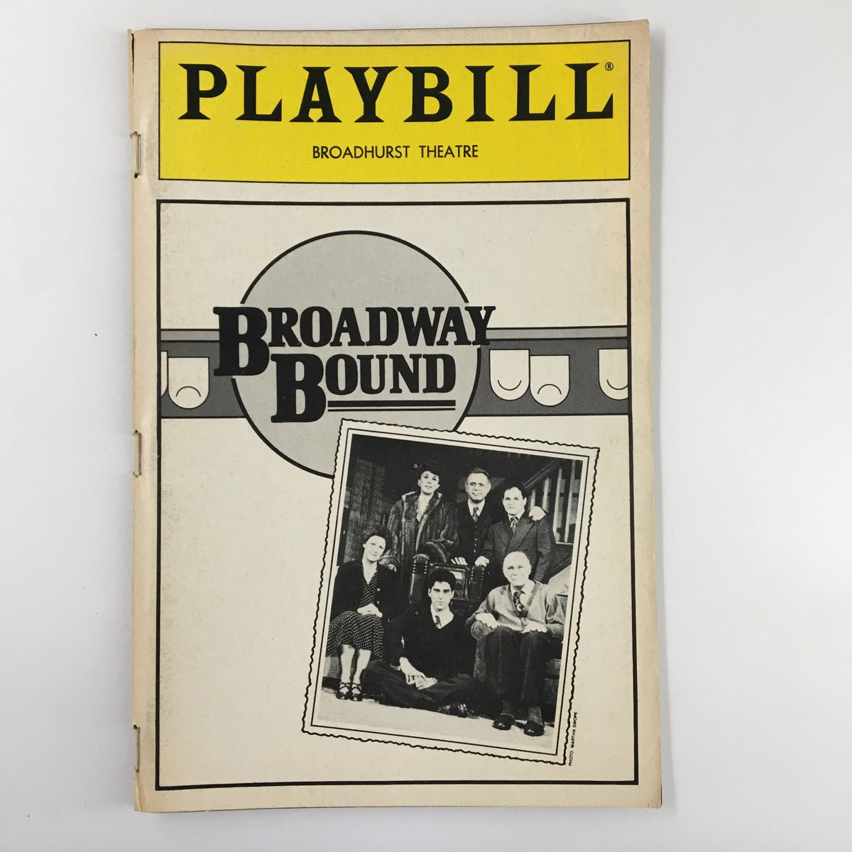 1986 Playbill from the Broadhurst Theatre featuring Broadway Bound by Neil Simon, showcasing a cast photo and classic theatrical design.