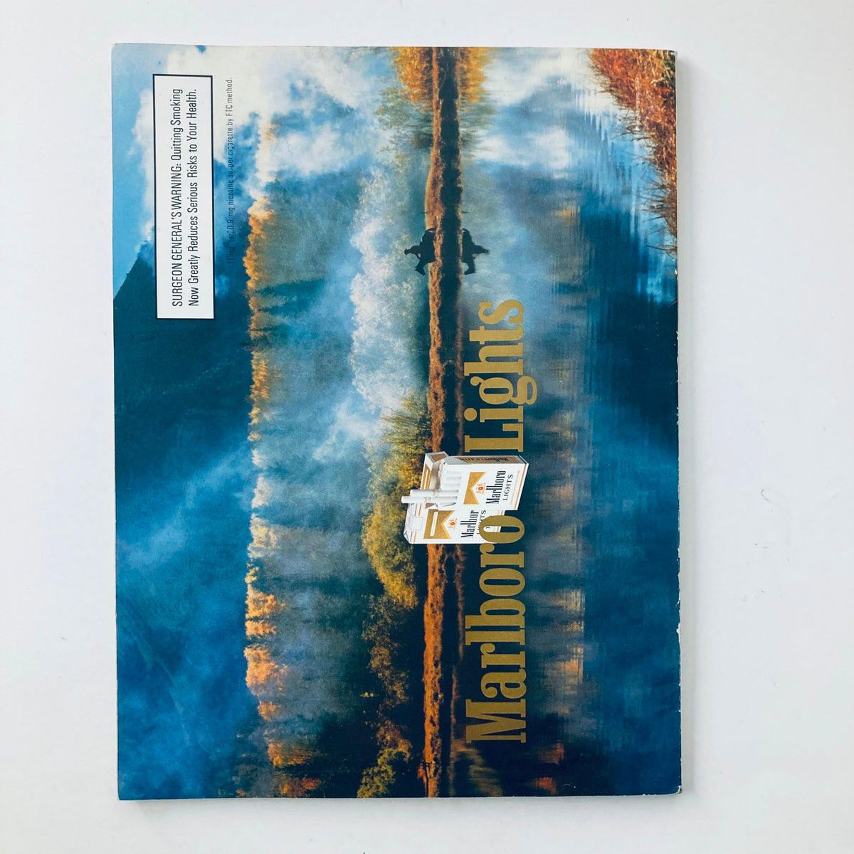 Back cover of Playboy Magazine April 1993, presenting artistic scenery with Marlboro Lights branding, part of a unique collectible experience.