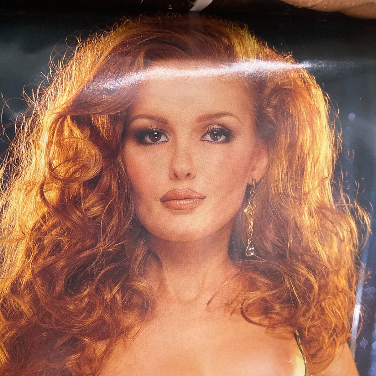 Close-up portrait of Lexie Karlsen from Playboy Magazine March 1999, showcasing her stunning features and iconic hairstyle.