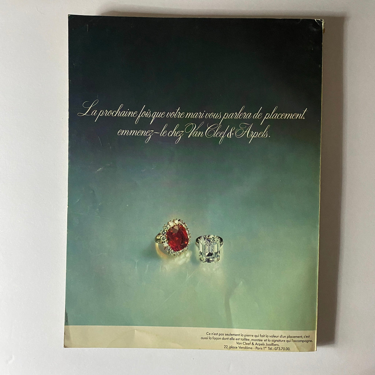 Back cover of Vogue Paris Magazine November 1973 featuring an elegant advertisement for Van Cleef & Arpels jewelry, showcasing two sparkling rings against a soft gradient background.
