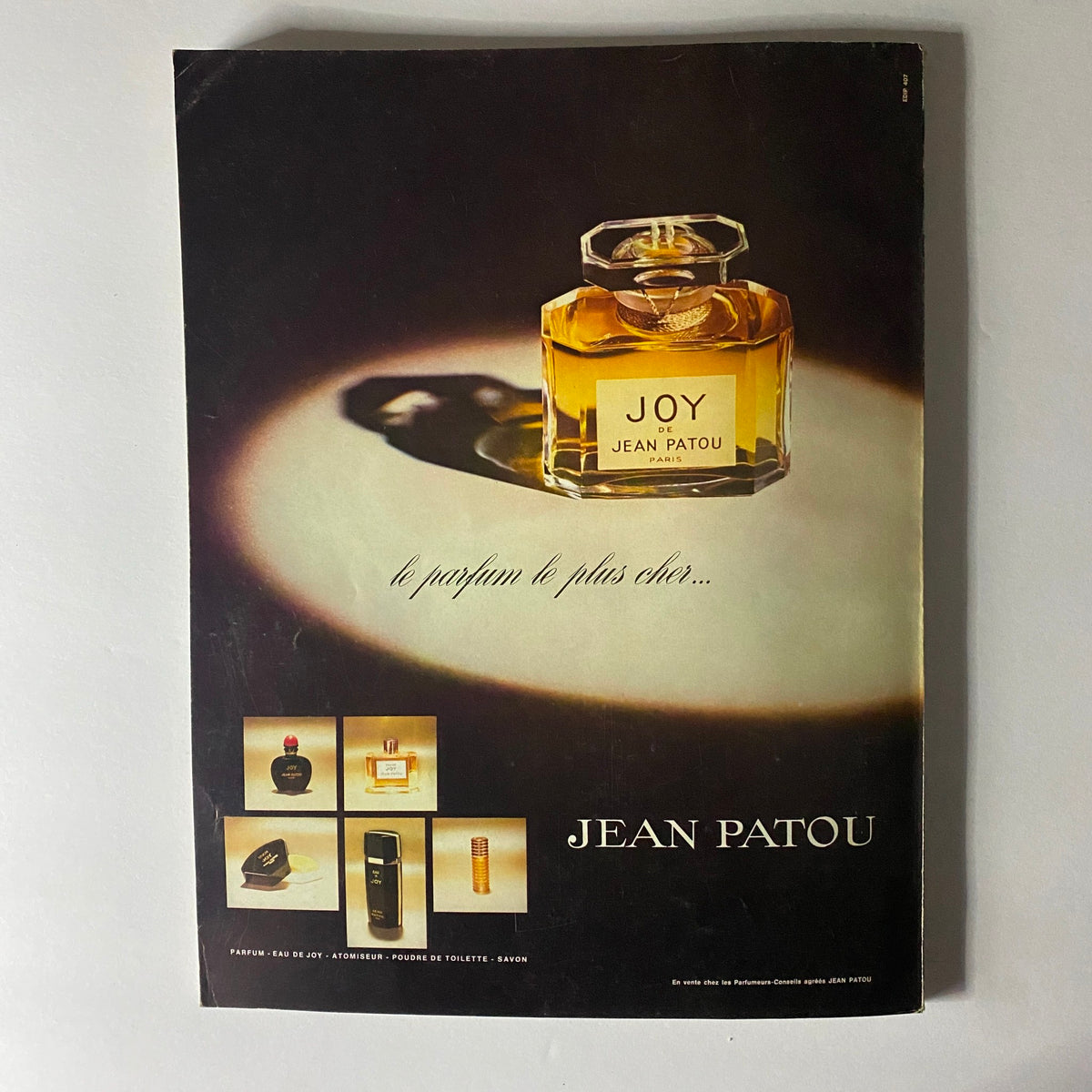 Vogue Paris Magazine October 1973 highlighting an advertisement for Jean Patou's fragrance 'Joy', showcasing the elegant perfume bottle.