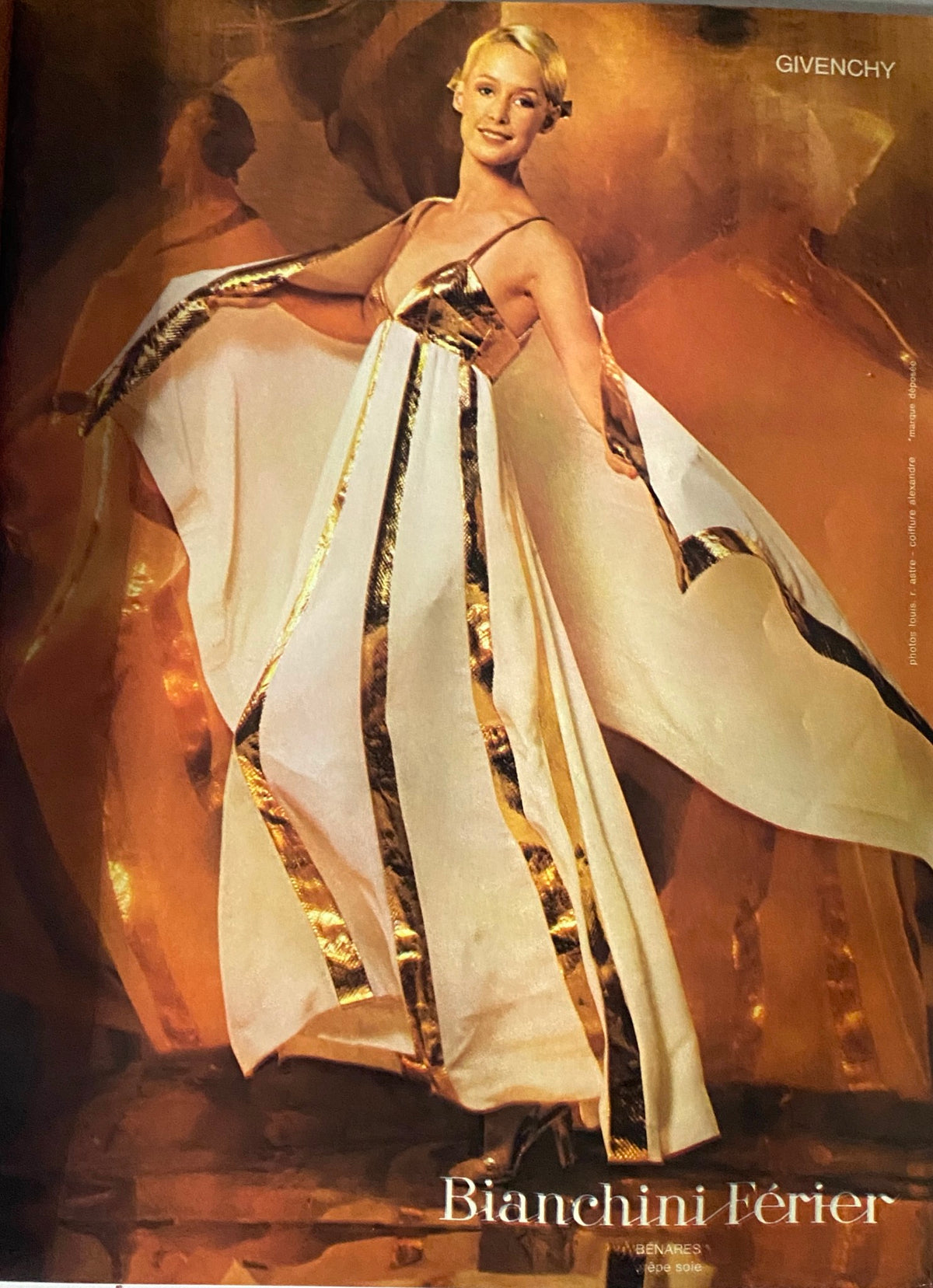 A fashion model wearing a Givenchy creation featured in Vogue Paris Magazine September 1973, highlighting a glamorous gown with gold accents.