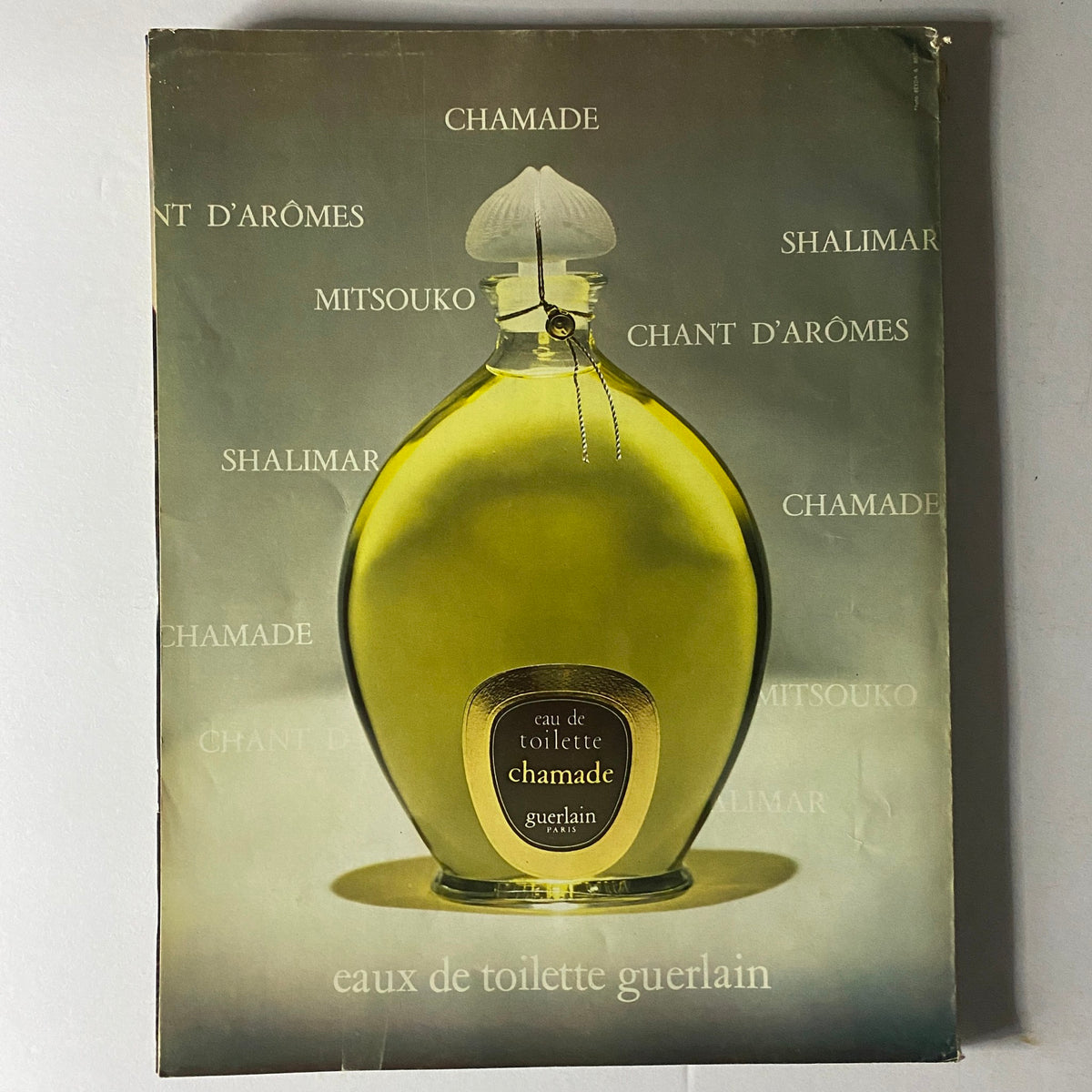 Vogue Paris Magazine May 1972 Charlotte Rampling Cover - Vintage perfume advertisement for Guerlain, complementing the fashion theme.