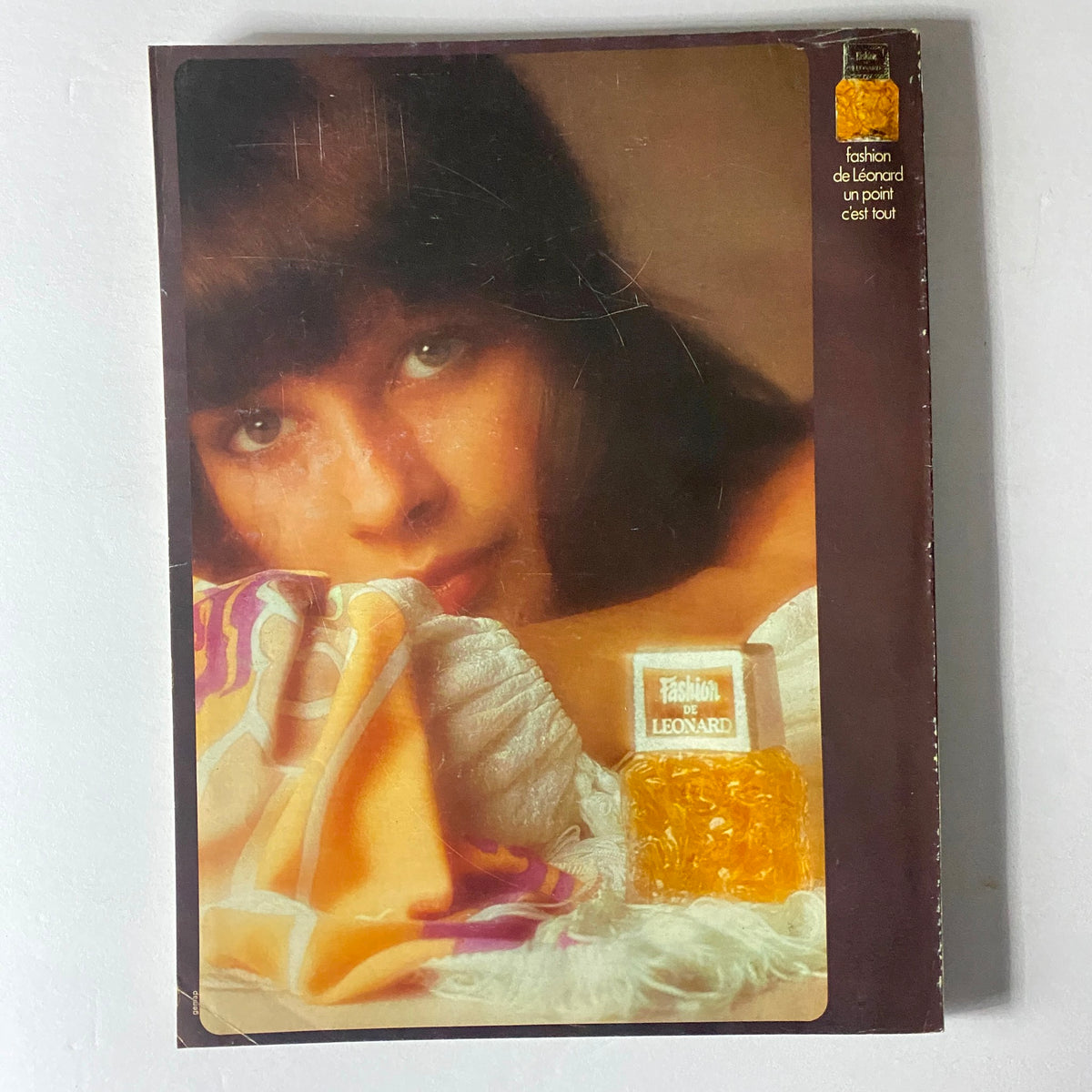 Back cover of Vogue Paris Magazine August 1972 displaying a model's portrait with fashion branding.