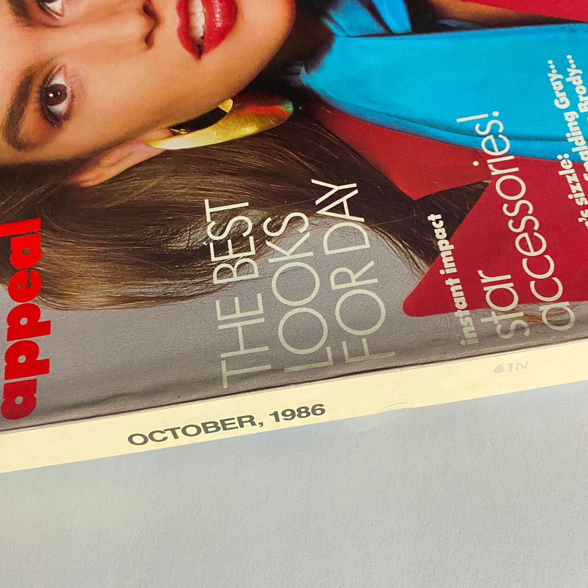 Close-up of Vogue Magazine October 1986, showcasing the title and features like 'The Best Looks for Day' and 'Star Accessories'.