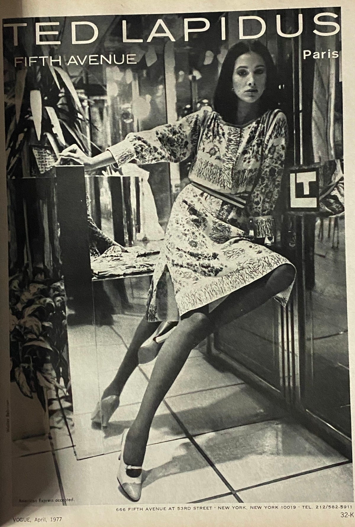 Vogue Magazine April 1977 Ted Lapidus fashion advertisement showcasing a model in a floral patterned dress, highlighting 1970s style trends.
