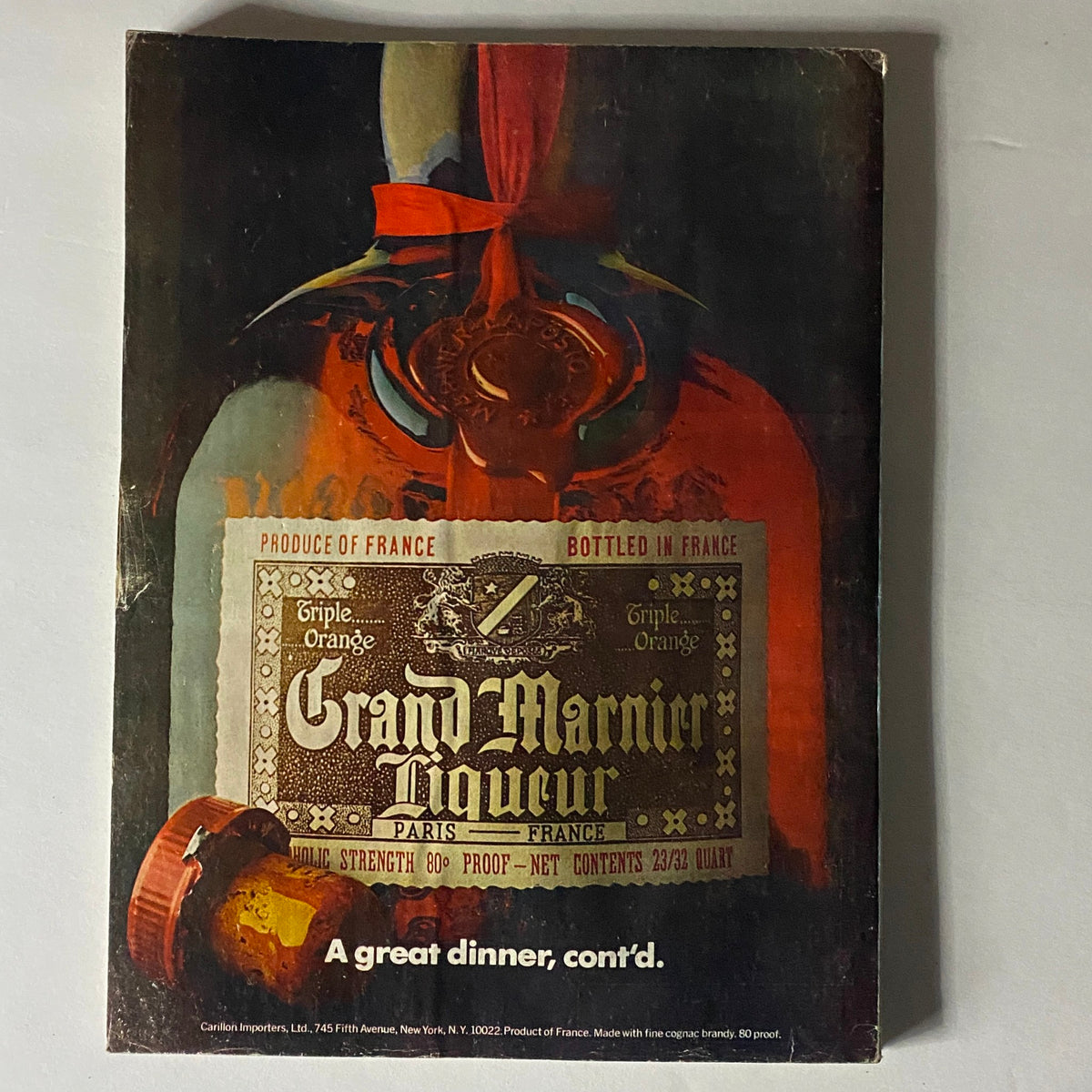 Back cover of Vogue Magazine February 1977 featuring Grand Marnier Liqueur advertisement, showcasing vintage marketing design elements.