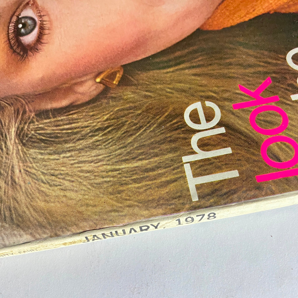 Close-up view of Vogue Magazine January 1978 cover with Rosie Vela's face, emphasizing her elegant features and fashion statement.