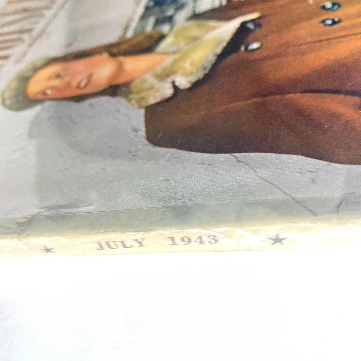 Close-up of the Mademoiselle Magazine July 1943 binding, highlighting the publication date, with the text 'JULY 1943', emphasizing its collectible vintage nature.