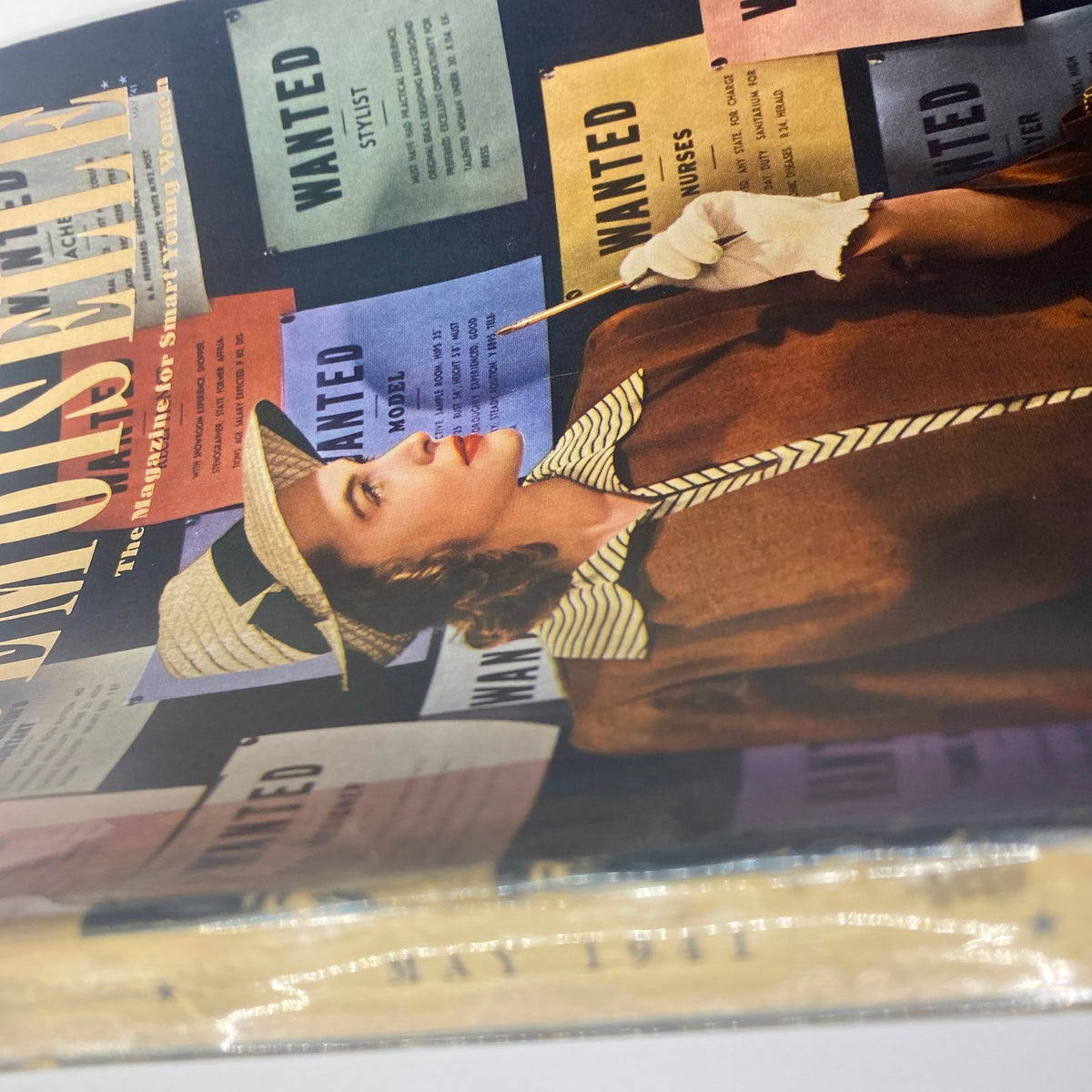 Side view of the Mademoiselle Magazine May 1941 Career Number, showing the vintage cover with a woman contemplating her career amidst job advertisements.