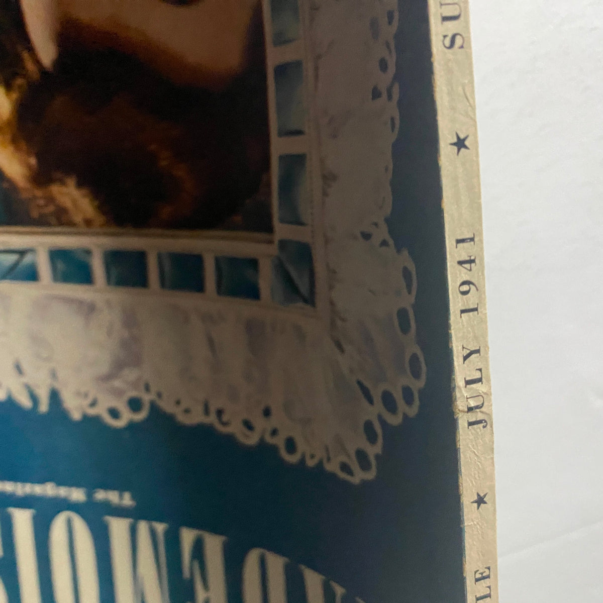 Side view of the cover of Mademoiselle Magazine July 1941 Summer Beauty Number, highlighting the publication date and decorative elements from the illustration.
