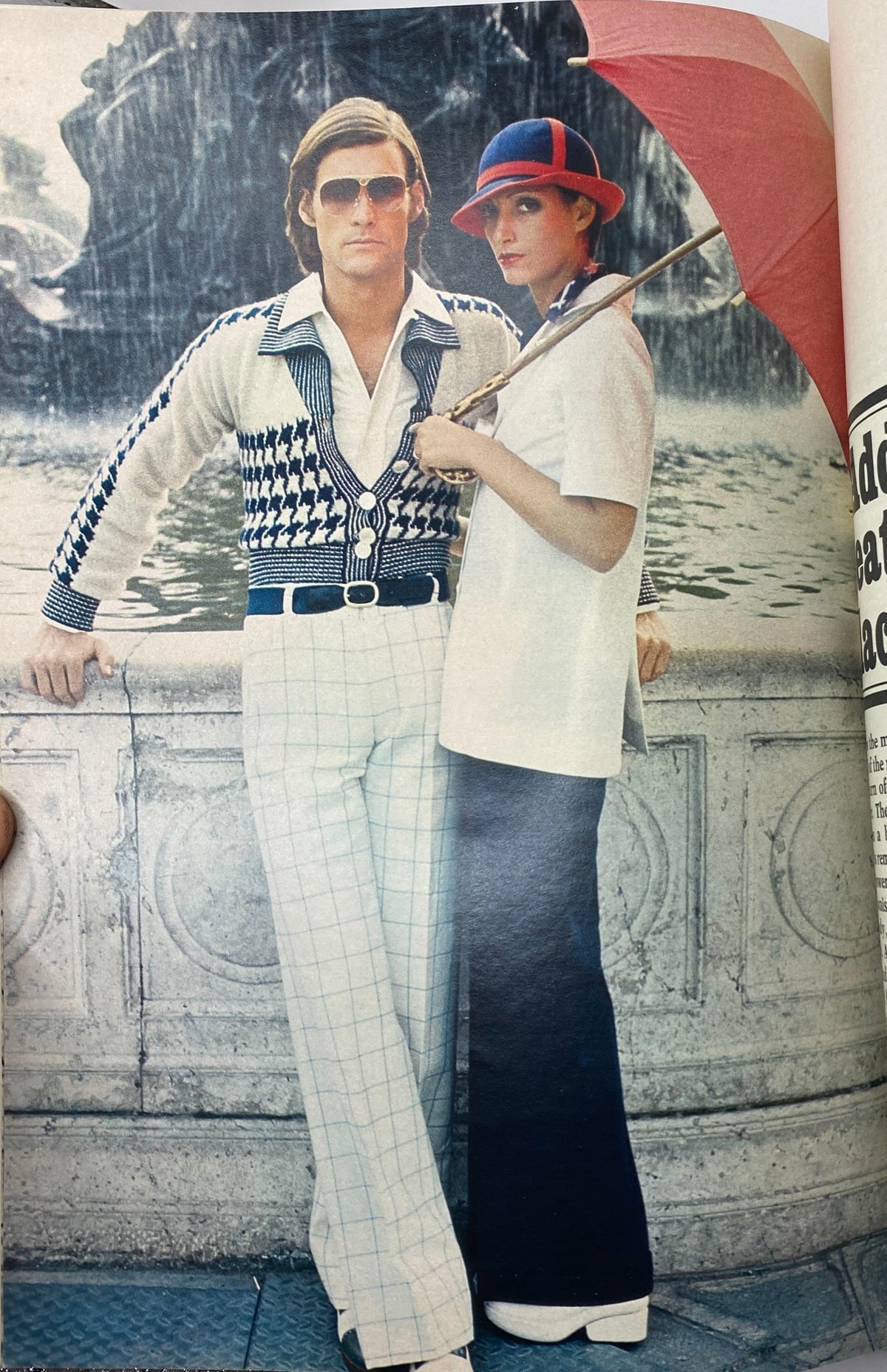 Fashion photography from Esquire Magazine February 1973 featuring a stylish couple by a water fountain, emphasizing retro clothing design.